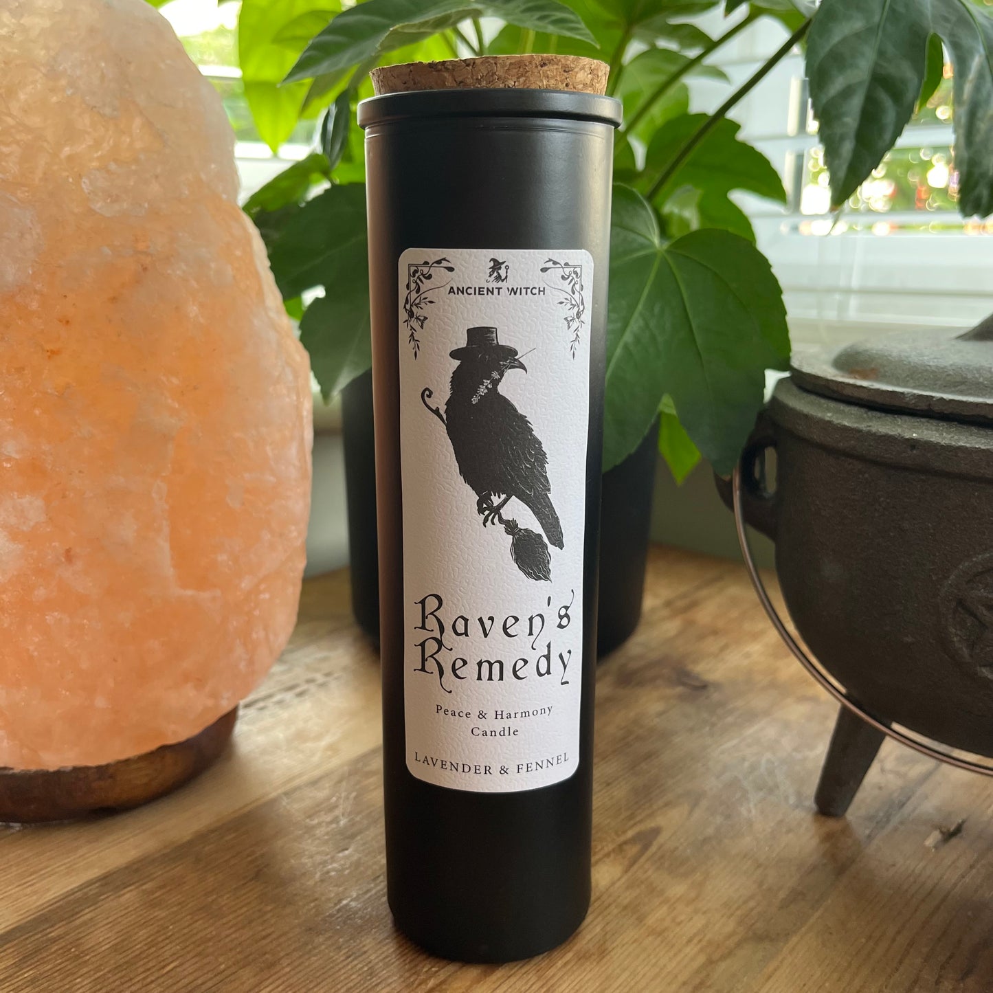 Ancient Witch Ravens Remedy candle in a beautifully illustrated gift box, illustrated with a Raven representing transformation, intuition, and protection. Each Glass pillar candle has a cork lid. Includes a ritual spell card.