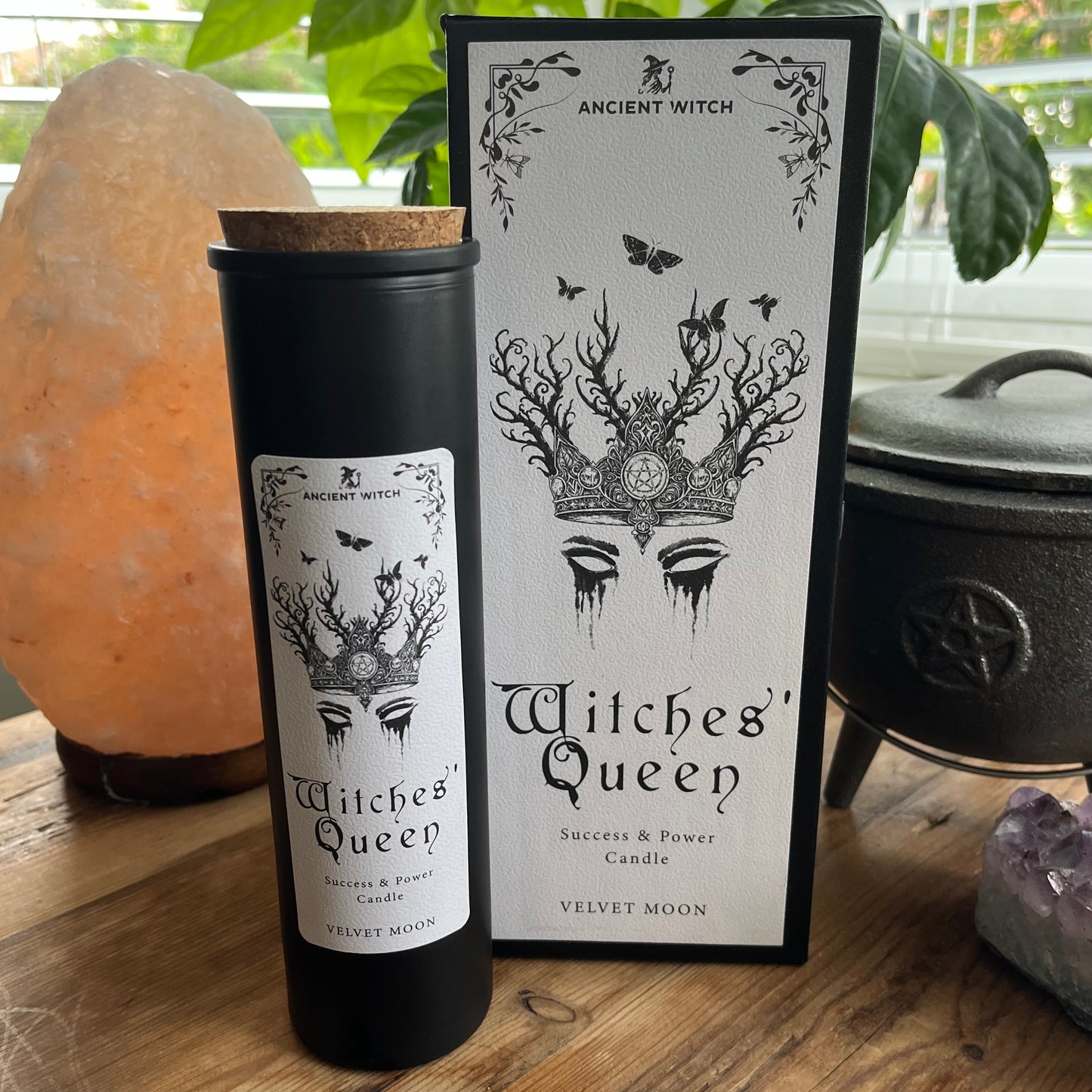 Ancient Witch Witches' Queen candle in a beautifully illustrated gift box, illustrated with a crown & moth representing courage, resilience and wisdom. Each Glass pillar candle has a cork lid. Includes a ritual spell card.