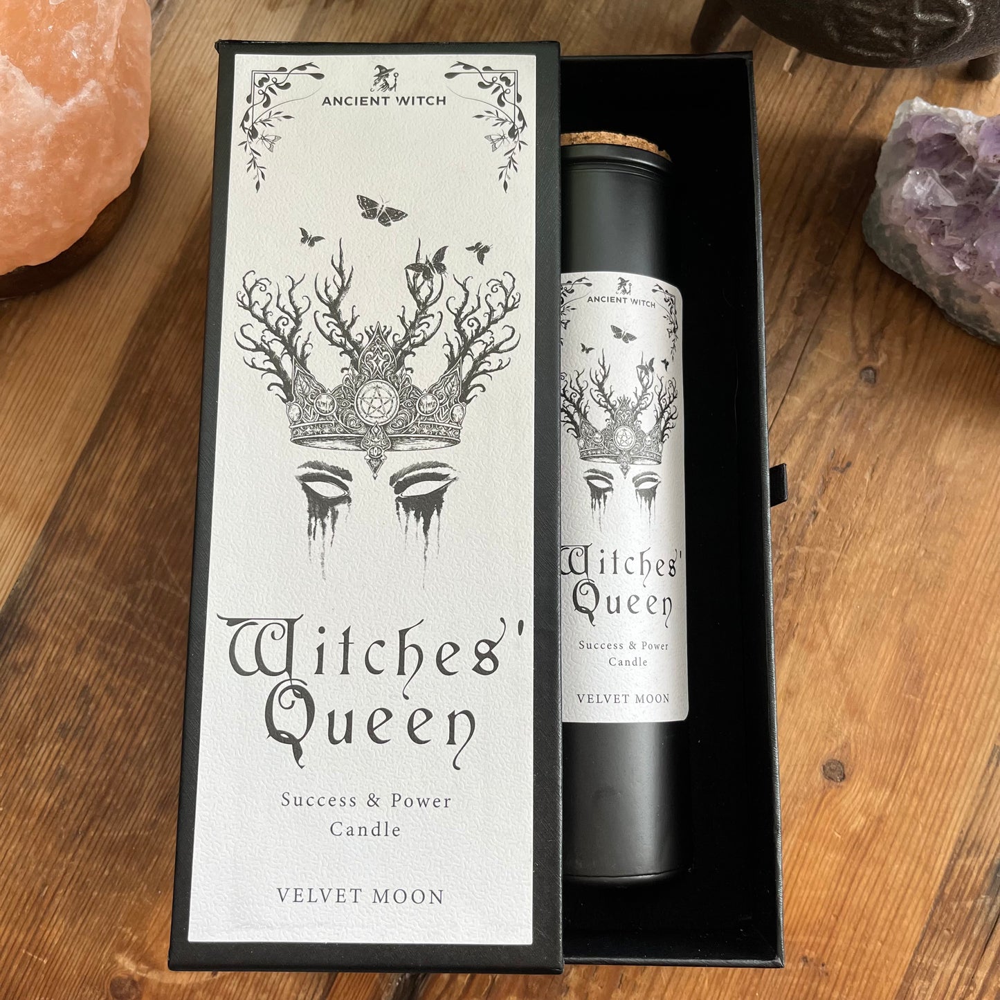 Ancient Witch Witches' Queen candle in a beautifully illustrated gift box, illustrated with a crown & moth representing courage, resilience and wisdom. Each Glass pillar candle has a cork lid. Includes a ritual spell card.