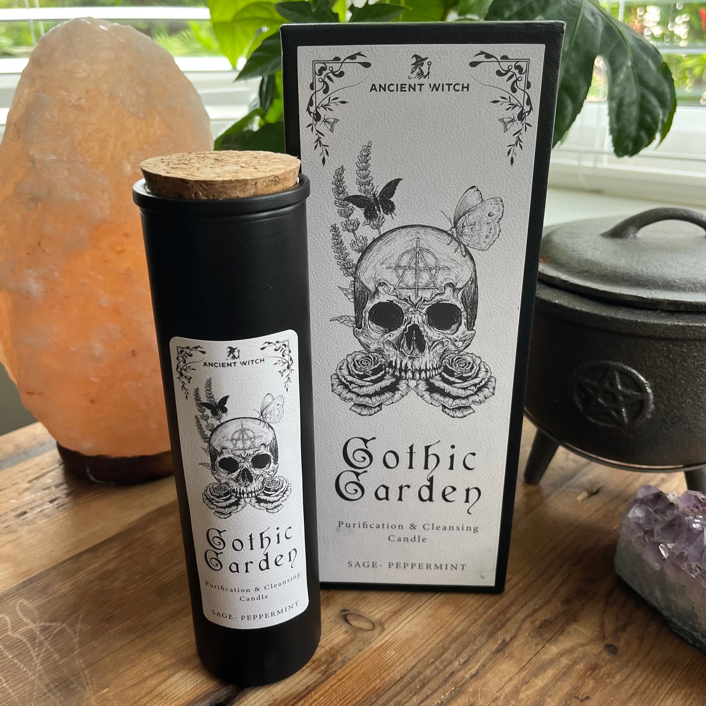 Ancient Witch Gothic Garden Candle with a beautifully illustrated gift box, illustrated with a skull & roses representing transformation. Each candle includes a ritual spell card.