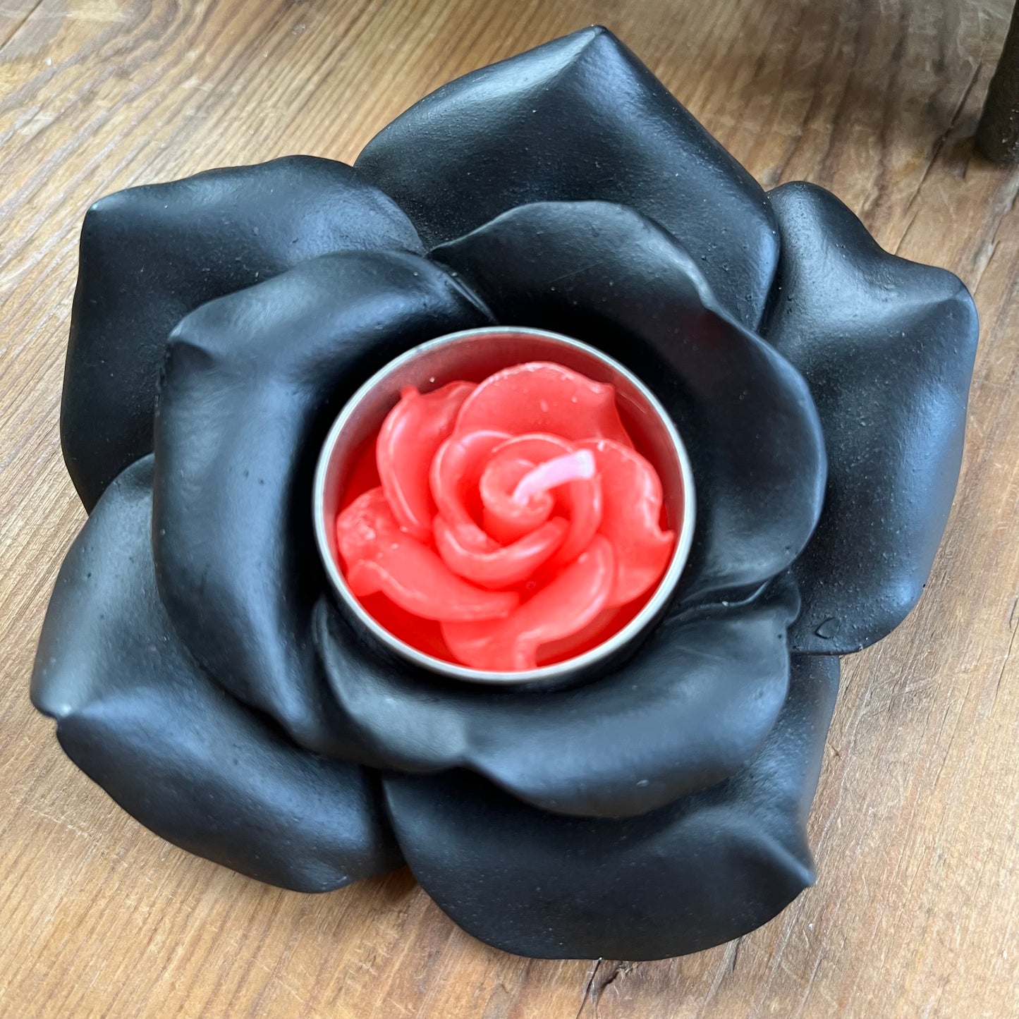 Black Rose Resin Tealight Candle Holder with a red tealight candle