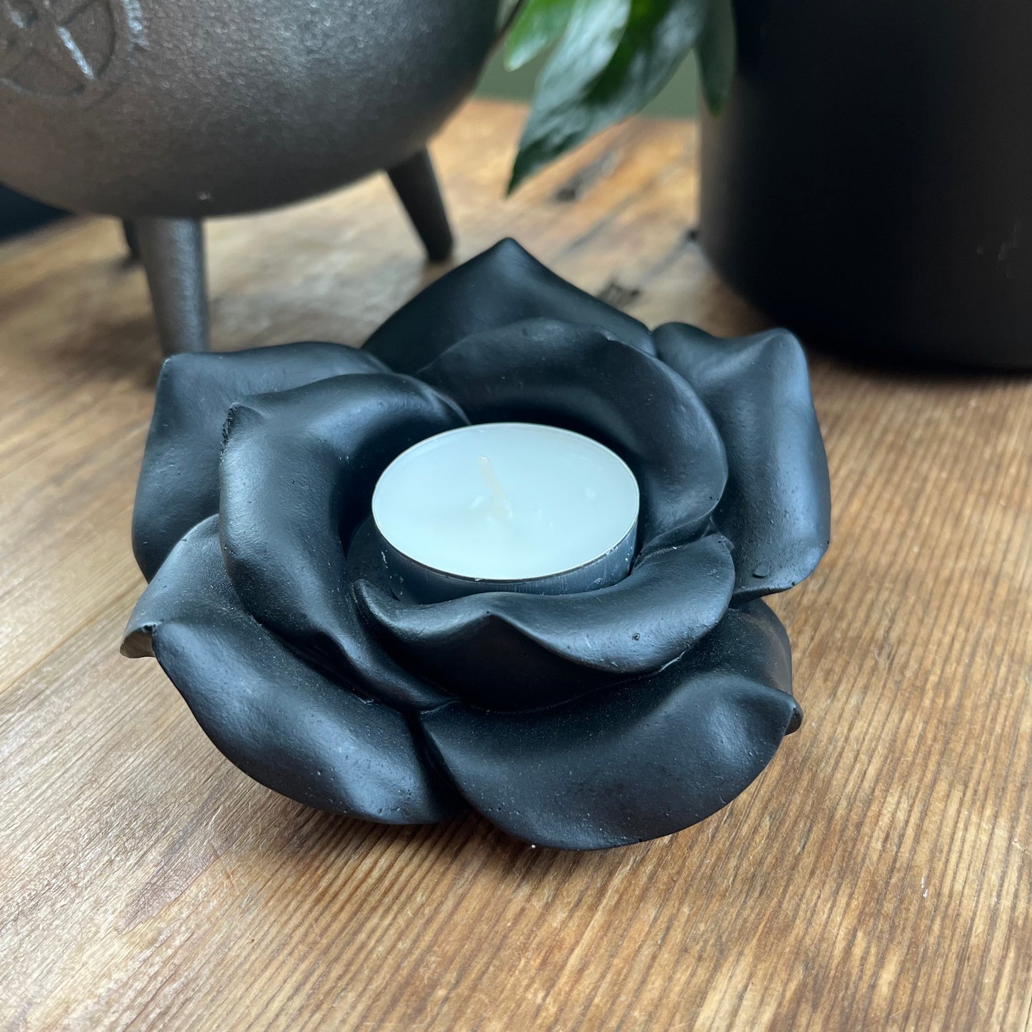 Black Rose Resin Tealight Candle Holder with a white tealight candle