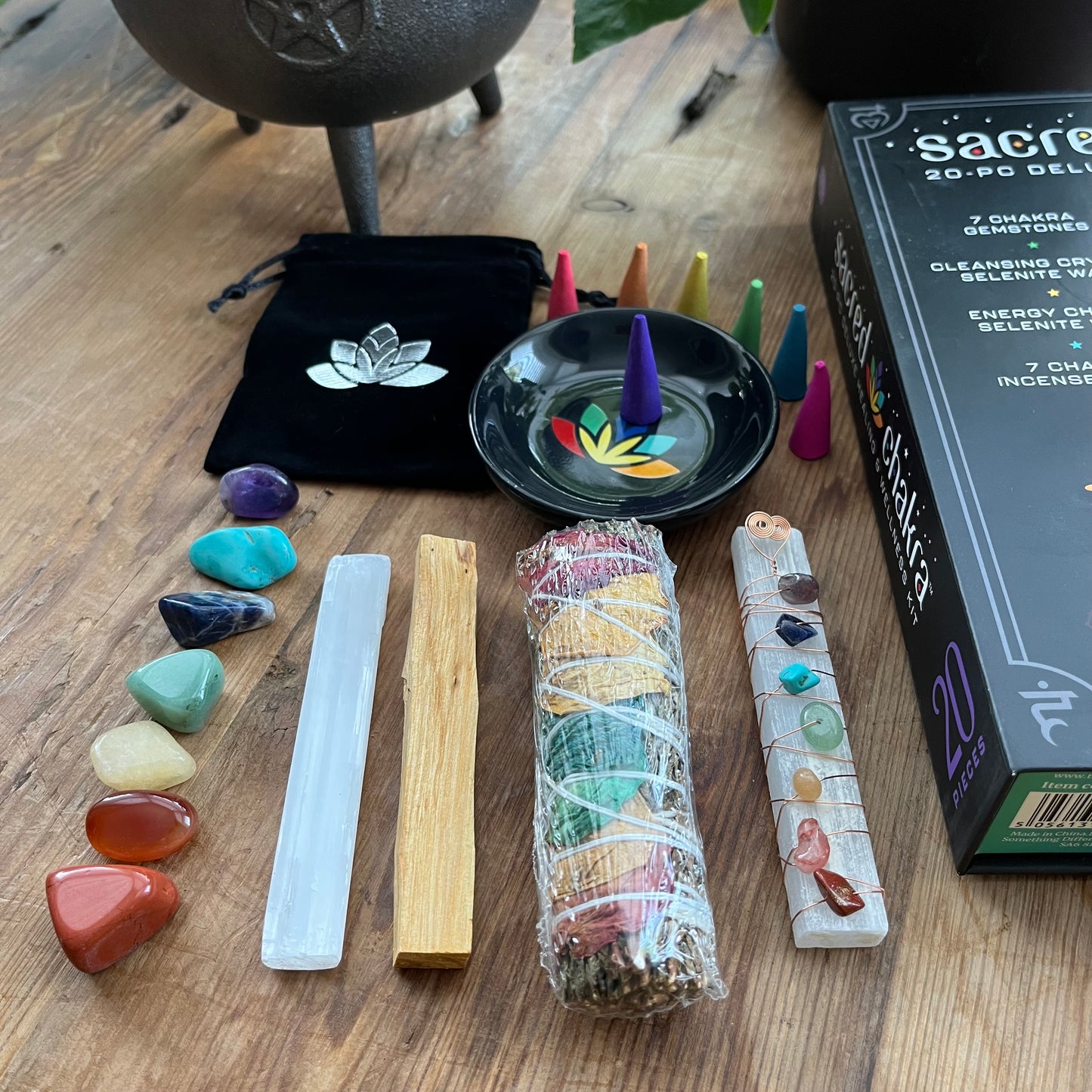 Sacred Chakra Kit 20 piece contents - tumblestones & pouch, selenite wand, copper wire gemstone wrapped selenite wand, palo santo, smudge stick, incense cones & incense plate