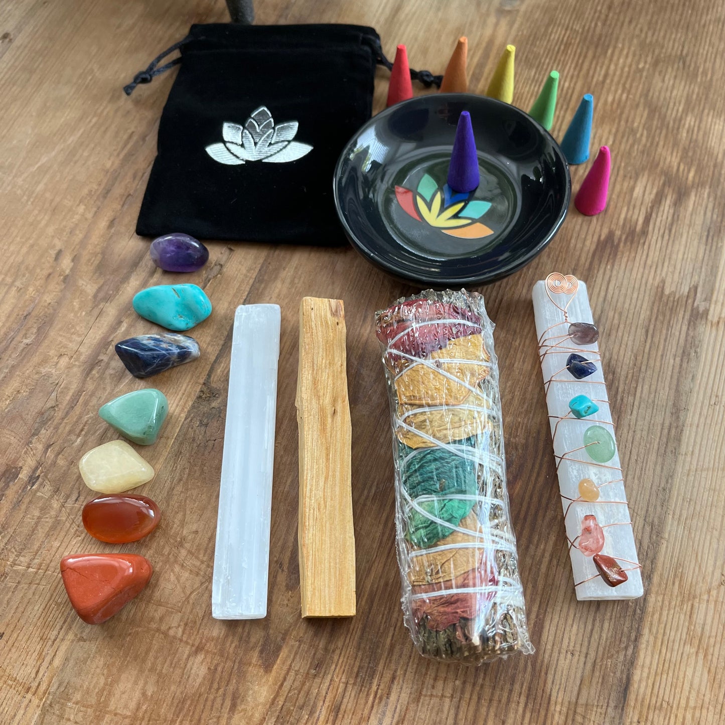 Sacred Chakra Kit 20 piece contents - tumblestones & pouch, selenite wand, copper wire gemstone wrapped selenite wand, palo santo, smudge stick, incense cones & incense plate
