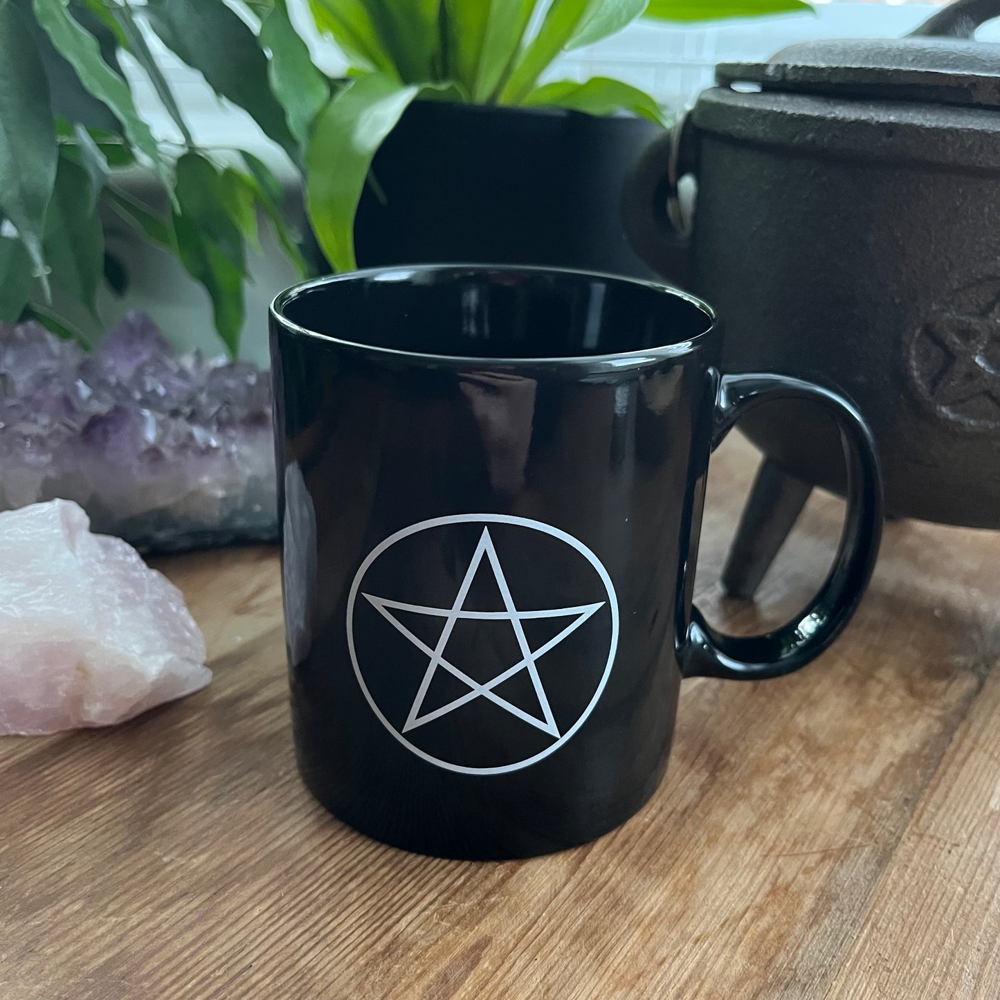 Black mug with a pentagram design