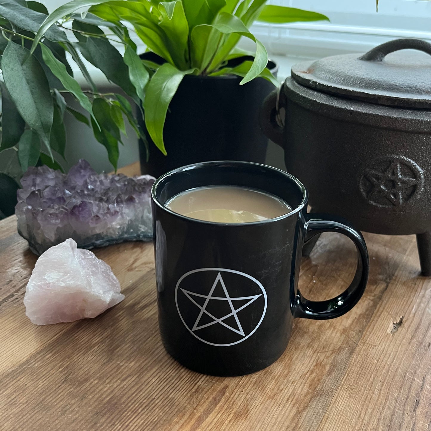 Black mug with a pentagram design
