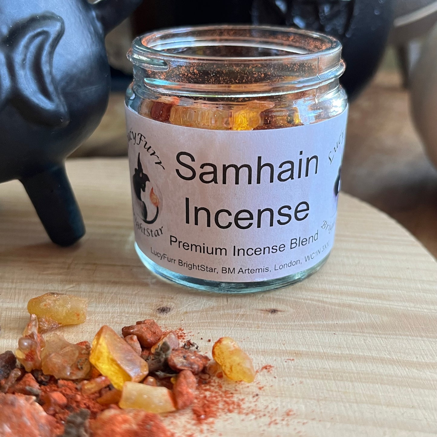 Jar of Samhain Incense with ingredients on a wooden surface