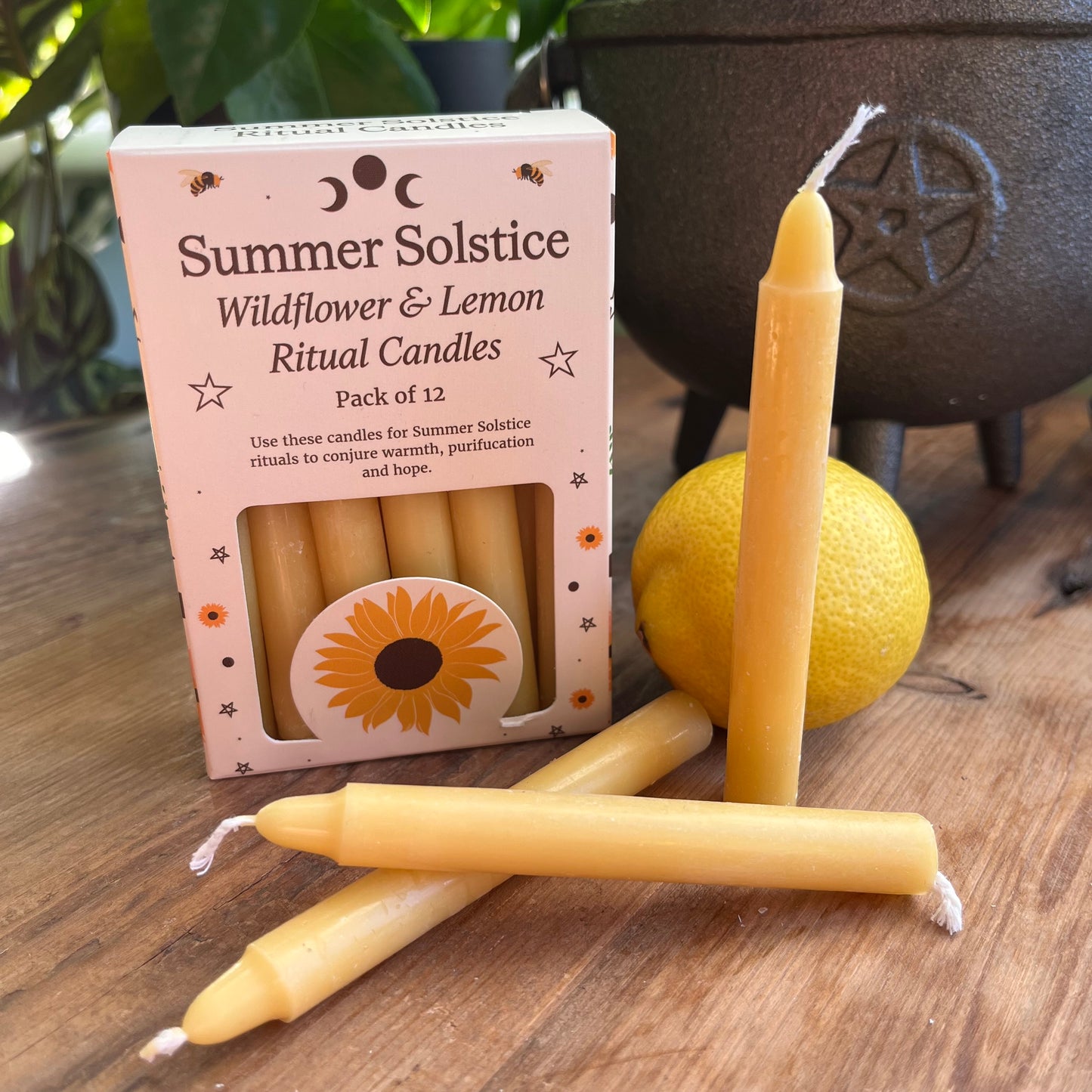 yellow ritual spell candles scented with wildflowers and lemon for the summer solstice