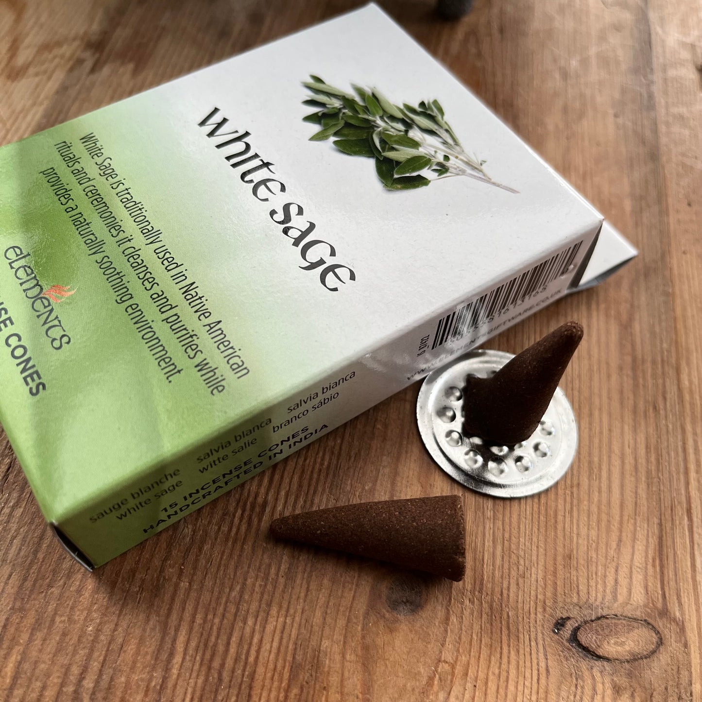 Box of White Sage Incense Cones on a wooden surface
