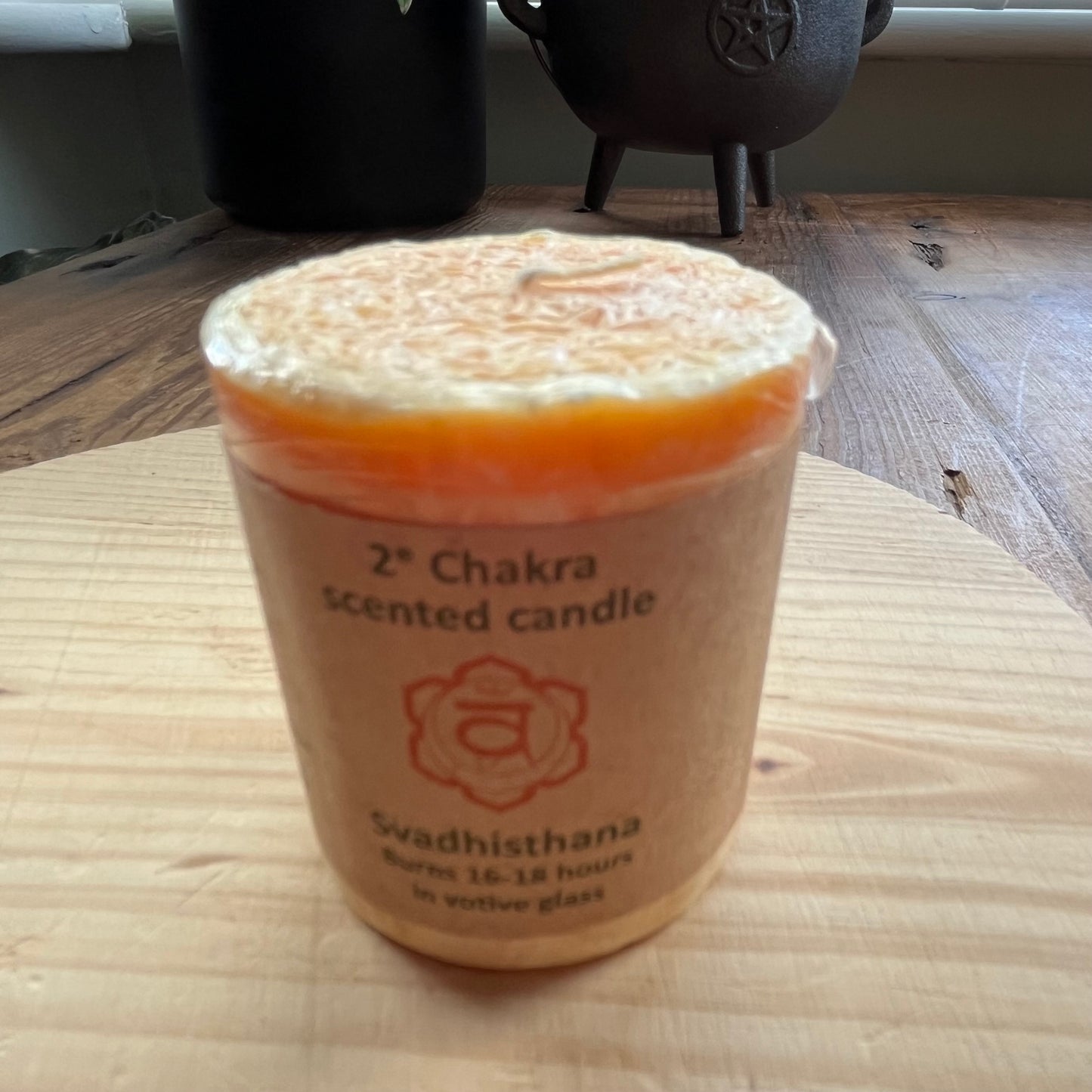 Small orange votive candle for sacral chakra