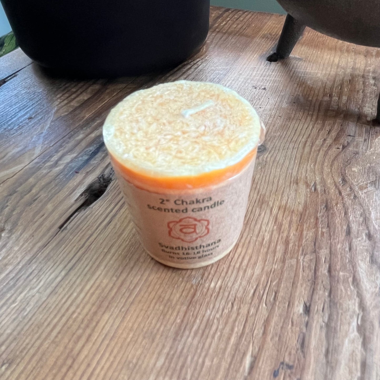 Small orange votive candle for sacral chakra