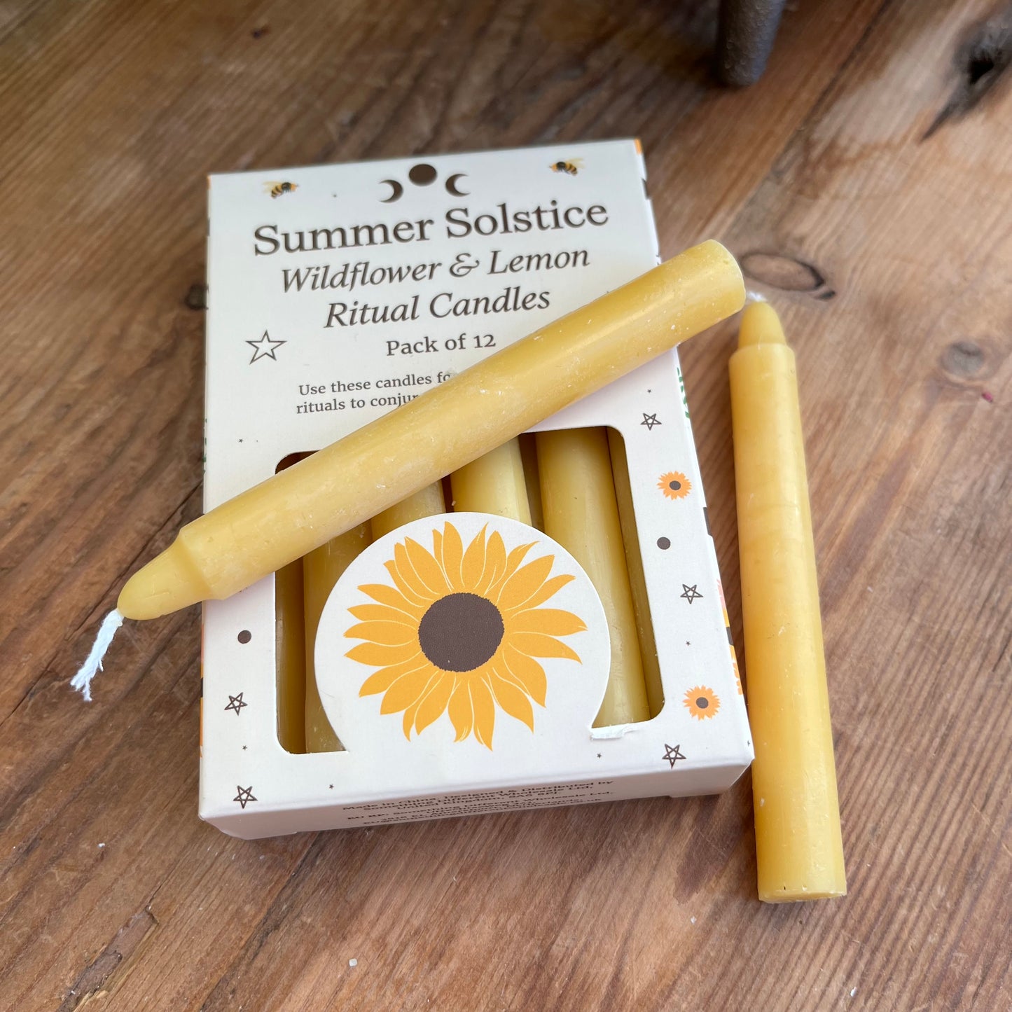 yellow ritual spell candles scented with wildflowers and lemon for the summer solstice