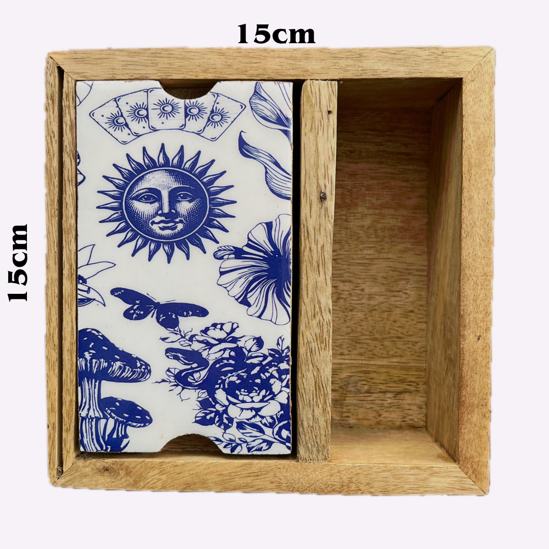 A wooden box with a divided interior with a white and blue illustrated  sun face, butterflies, flowers compartment lid