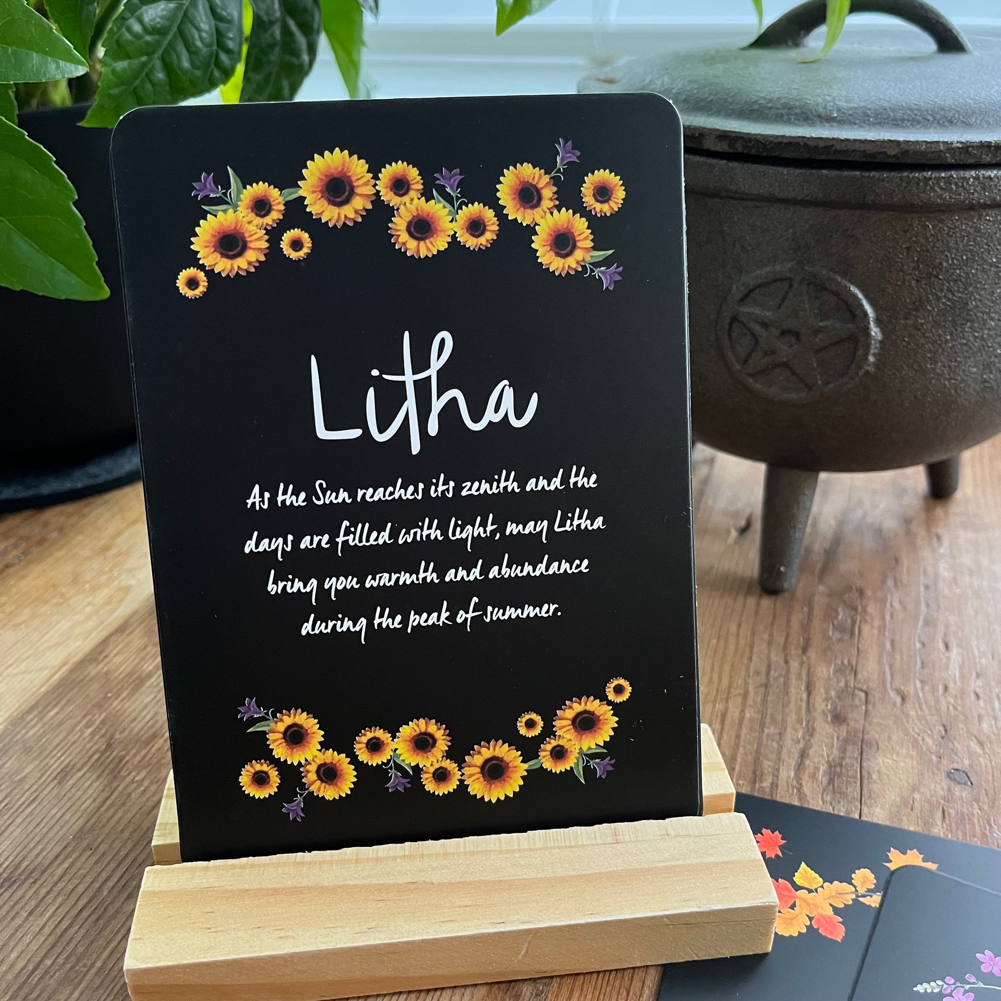 Decorative Altar card with sunflowers and Litha text on a wooden stand