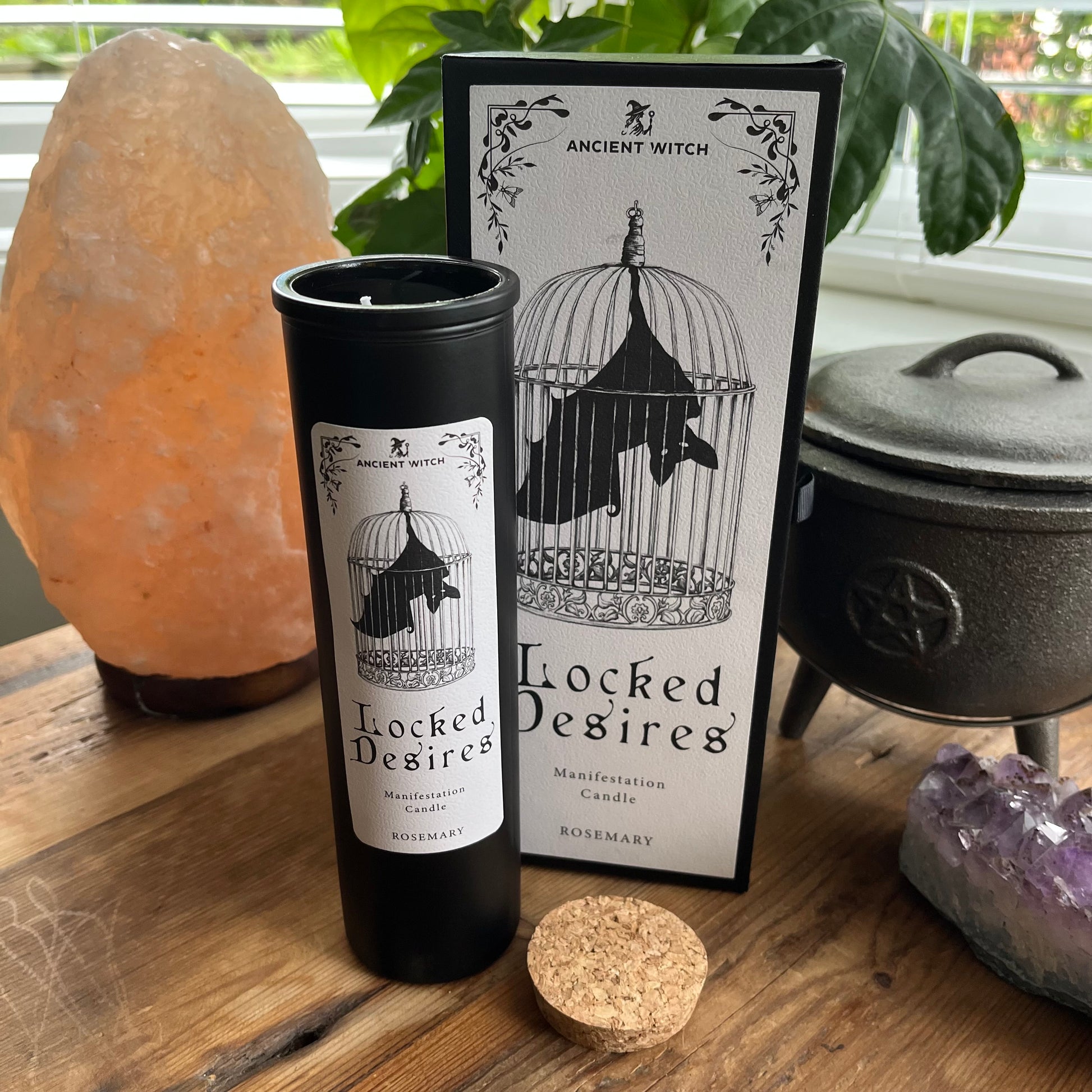 Ancient Witch Locked Desires candle in a beautifully illustrated gift box, illustrated with a Bat in a cage representing suppressed dreams, inner power and courage.  Each Glass pillar candle has a cork lid. Includes a ritual spell card. 
