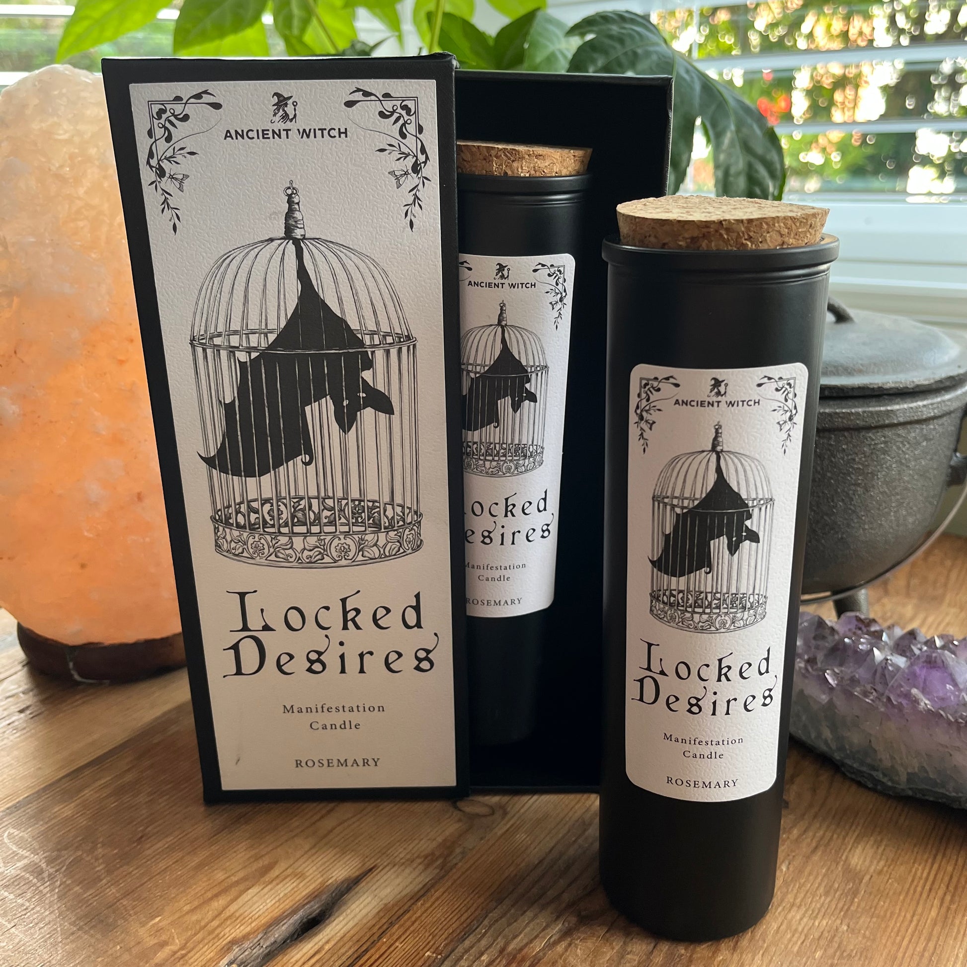 Ancient Witch Locked Desires candle in a beautifully illustrated gift box, illustrated with a Bat in a cage representing suppressed dreams, inner power and courage.  Each Glass pillar candle has a cork lid. Includes a ritual spell card. 