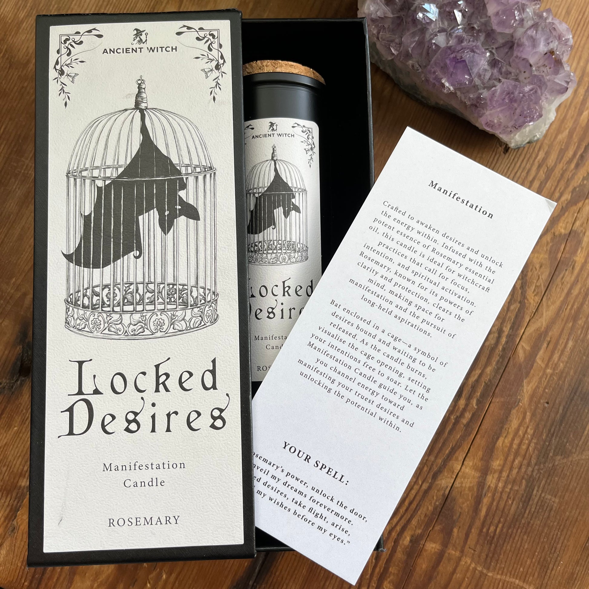 Ancient Witch Locked Desires candle in a beautifully illustrated gift box, illustrated with a Bat in a cage representing suppressed dreams, inner power and courage.  Each Glass pillar candle has a cork lid. Includes a ritual spell card. 