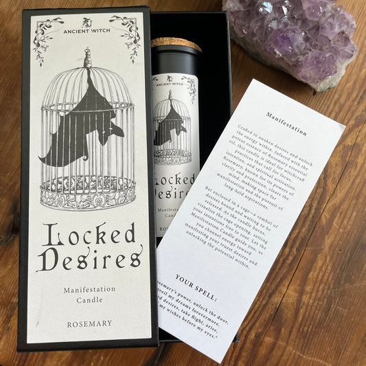 Ancient Witch Locked Desires candle in a beautifully illustrated gift box, illustrated with a Bat in a cage representing suppressed dreams, inner power and courage.  Each Glass pillar candle has a cork lid. Includes a ritual spell card. 