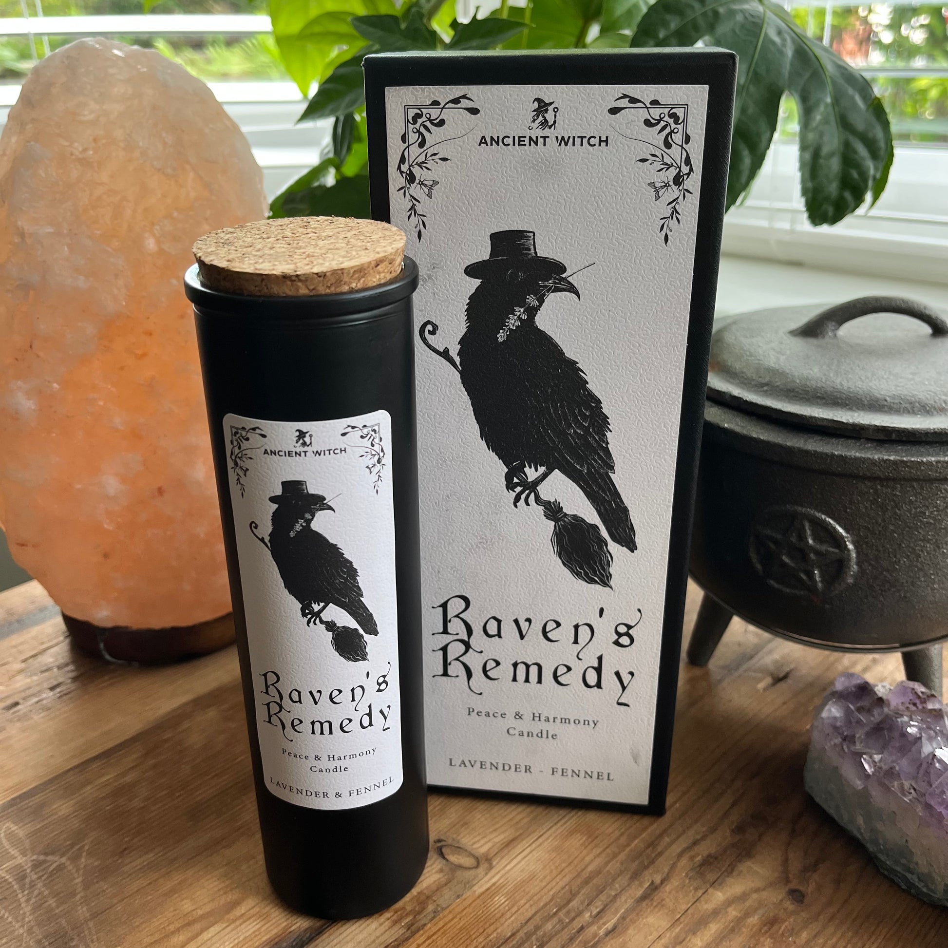 Ancient Witch Ravens Remedy candle in a beautifully illustrated gift box, illustrated with a Raven representing transformation, intuition, and protection.  Each Glass pillar candle has a cork lid. Includes a ritual spell card. 