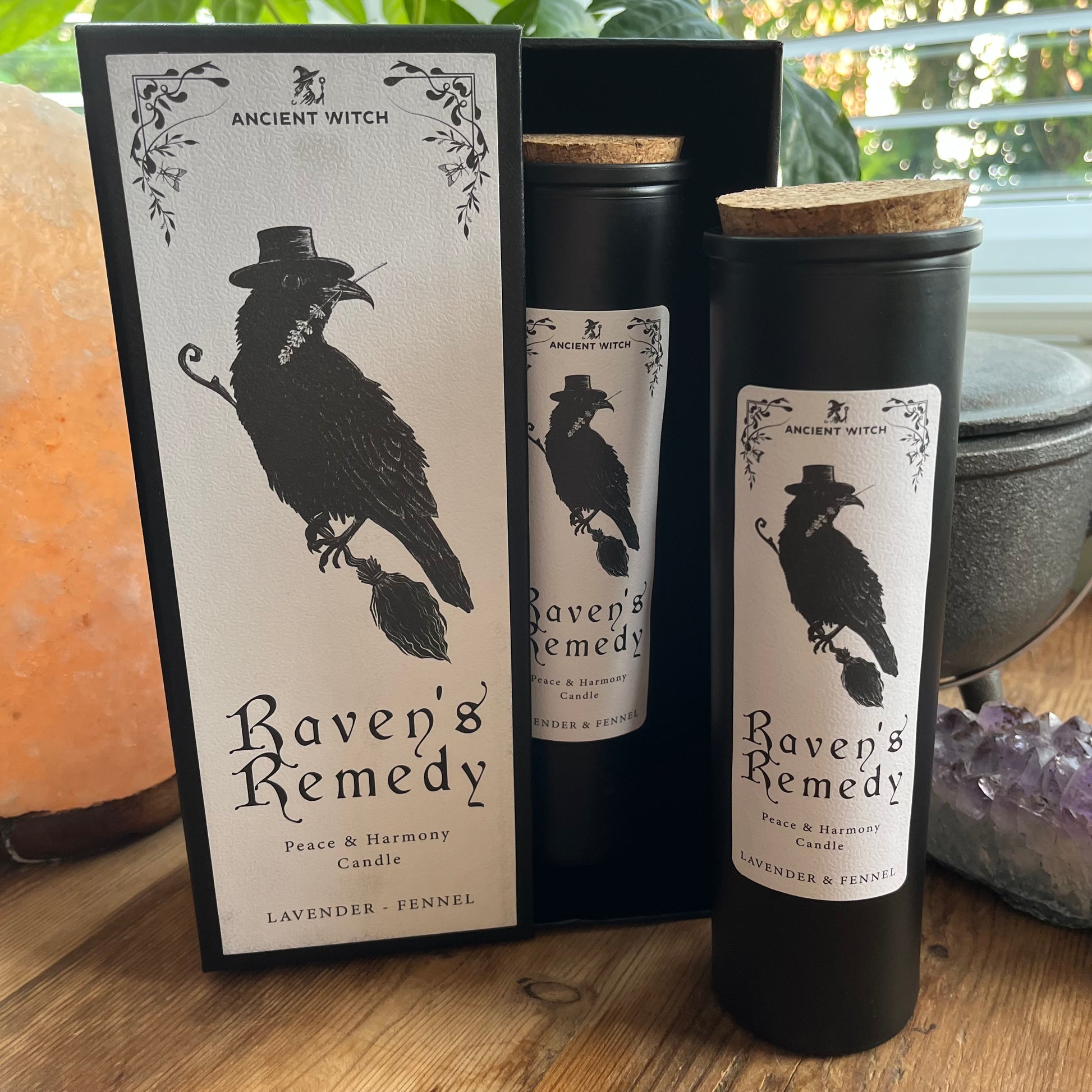 Ancient Witch Ravens Remedy candle in a beautifully illustrated gift box, illustrated with a Raven representing transformation, intuition, and protection.  Each Glass pillar candle has a cork lid. Includes a ritual spell card. 