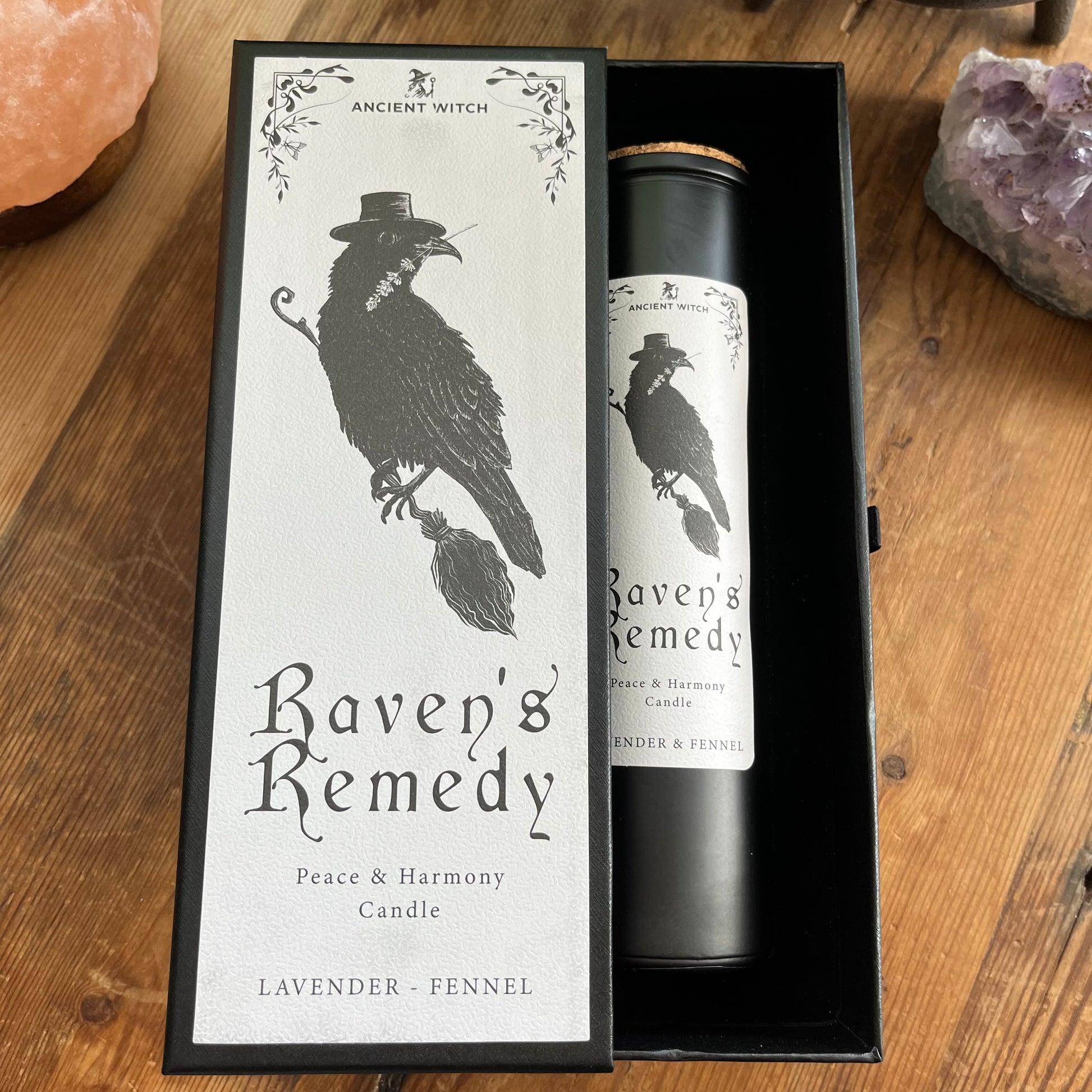 Ancient Witch Ravens Remedy candle in a beautifully illustrated gift box, illustrated with a Raven representing transformation, intuition, and protection.  Each Glass pillar candle has a cork lid. Includes a ritual spell card. 