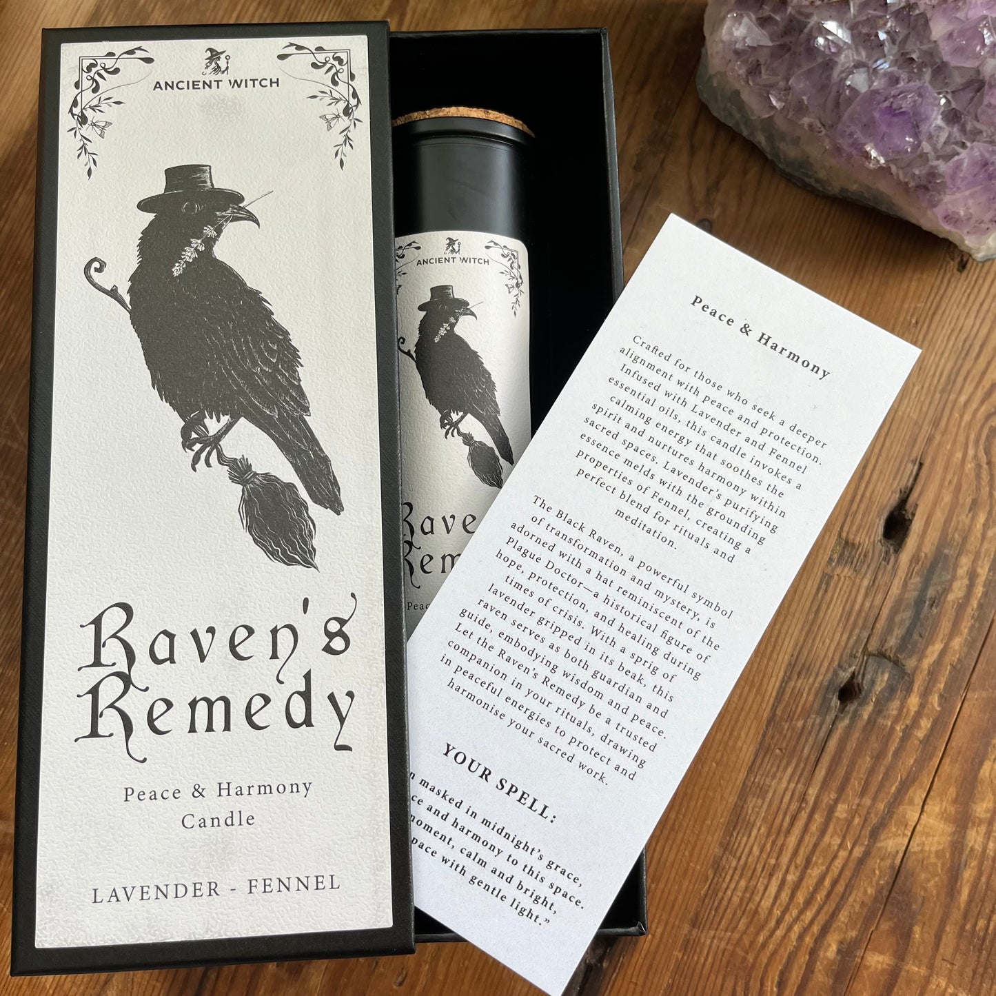 Ancient Witch Ravens Remedy candle in a beautifully illustrated gift box, illustrated with a Raven representing transformation, intuition, and protection.  Each Glass pillar candle has a cork lid. Includes a ritual spell card. 