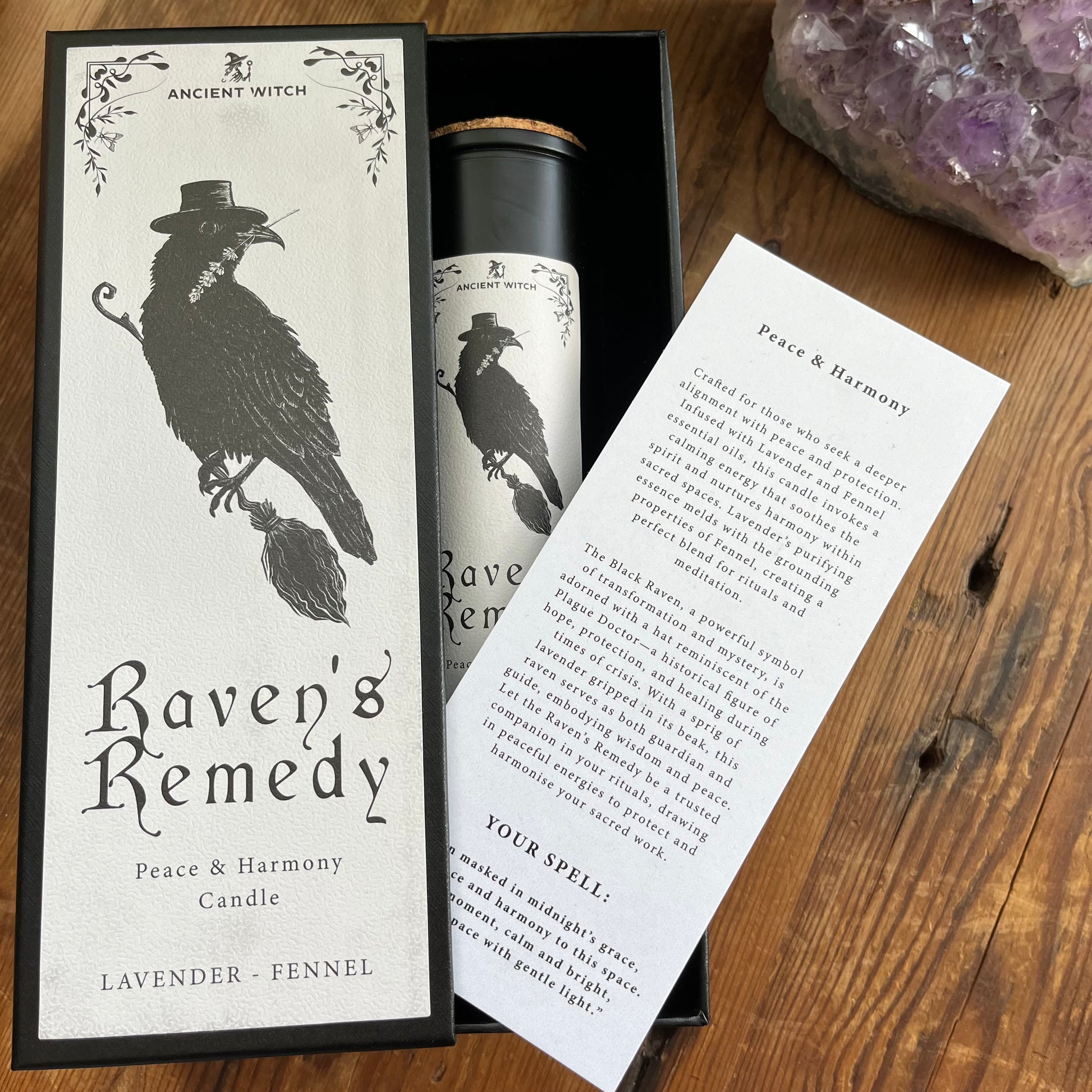 Ancient Witch Ravens Remedy candle in a beautifully illustrated gift box, illustrated with a Raven representing transformation, intuition, and protection.  Each Glass pillar candle has a cork lid. Includes a ritual spell card. 