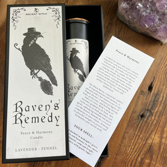 Ancient Witch Ravens Remedy candle in a beautifully illustrated gift box, illustrated with a Raven representing transformation, intuition, and protection.  Each Glass pillar candle has a cork lid. Includes a ritual spell card. 