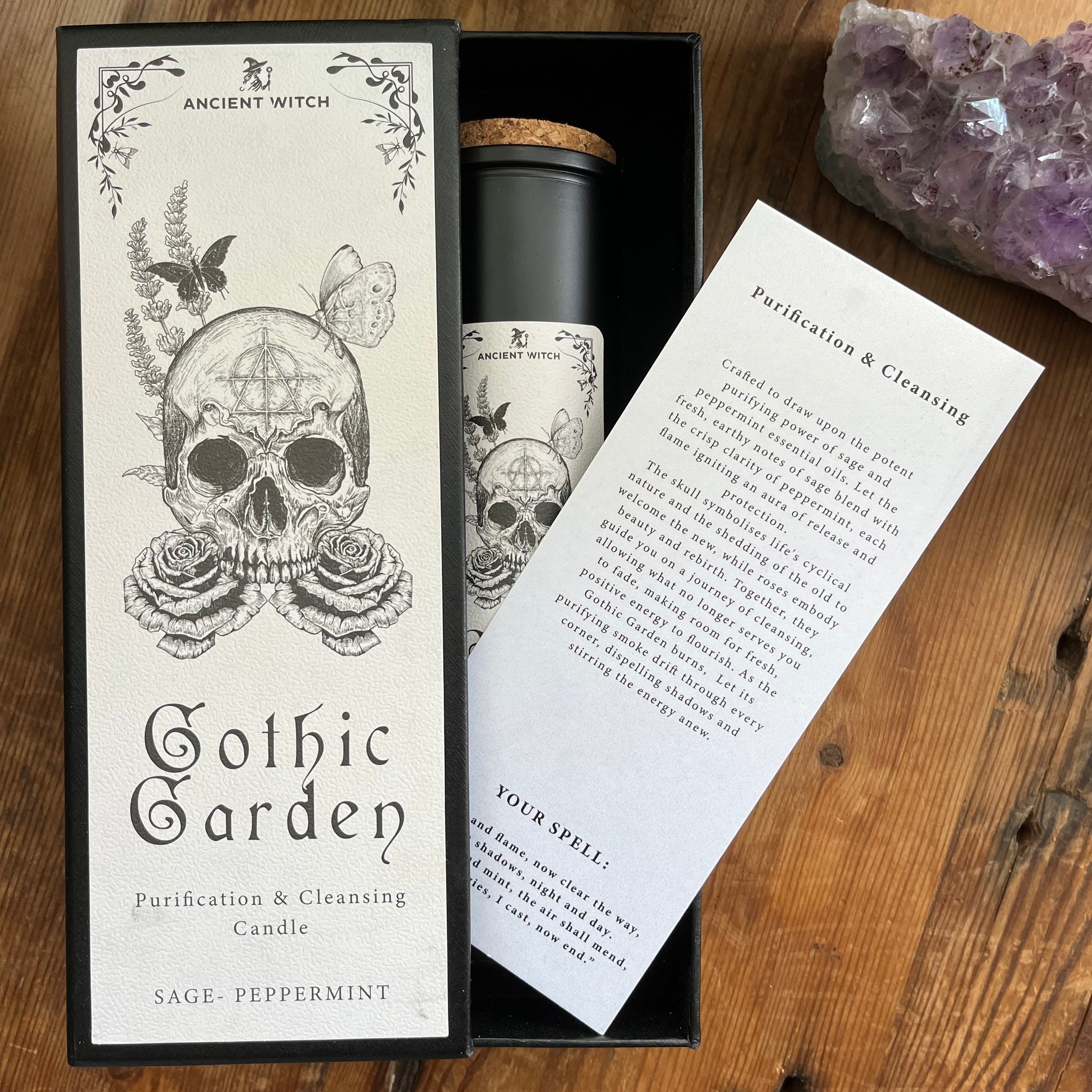Ancient Witch Gothic Garden Candle Packaged in a beautifully illustrated gift box, each candle includes a ritual spell card. Design on the box & candle - a skull and roses, representing transformation