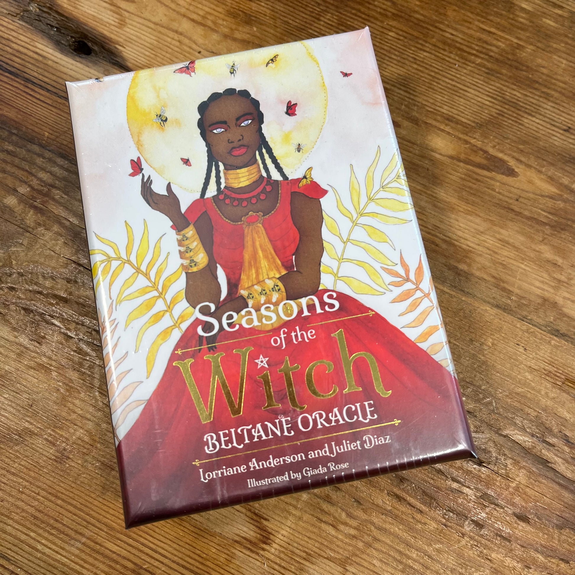 'Seasons of the Witch: Beltane Oracle' on a wooden surface