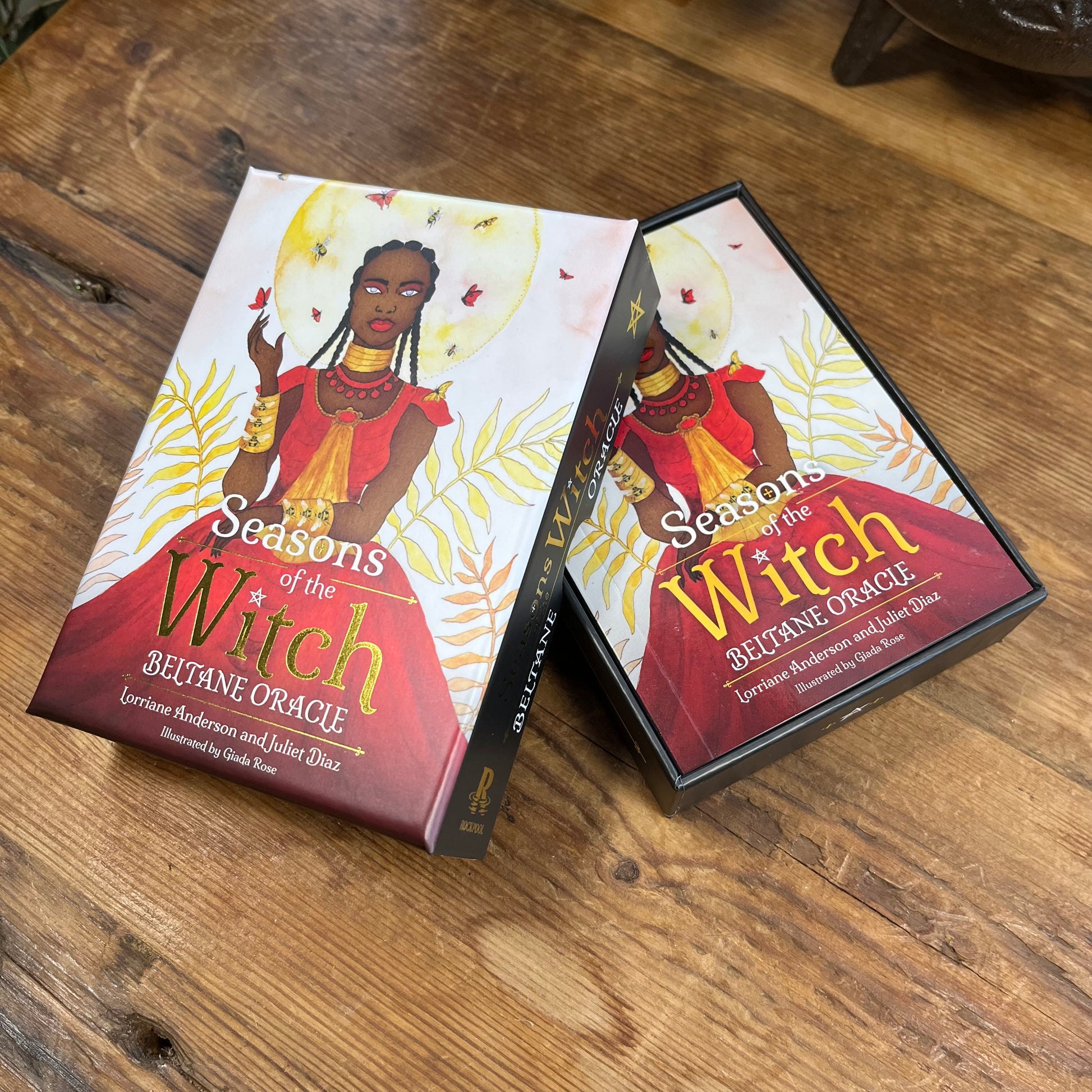 Seasons of the Witch oracle cards on a wooden surface