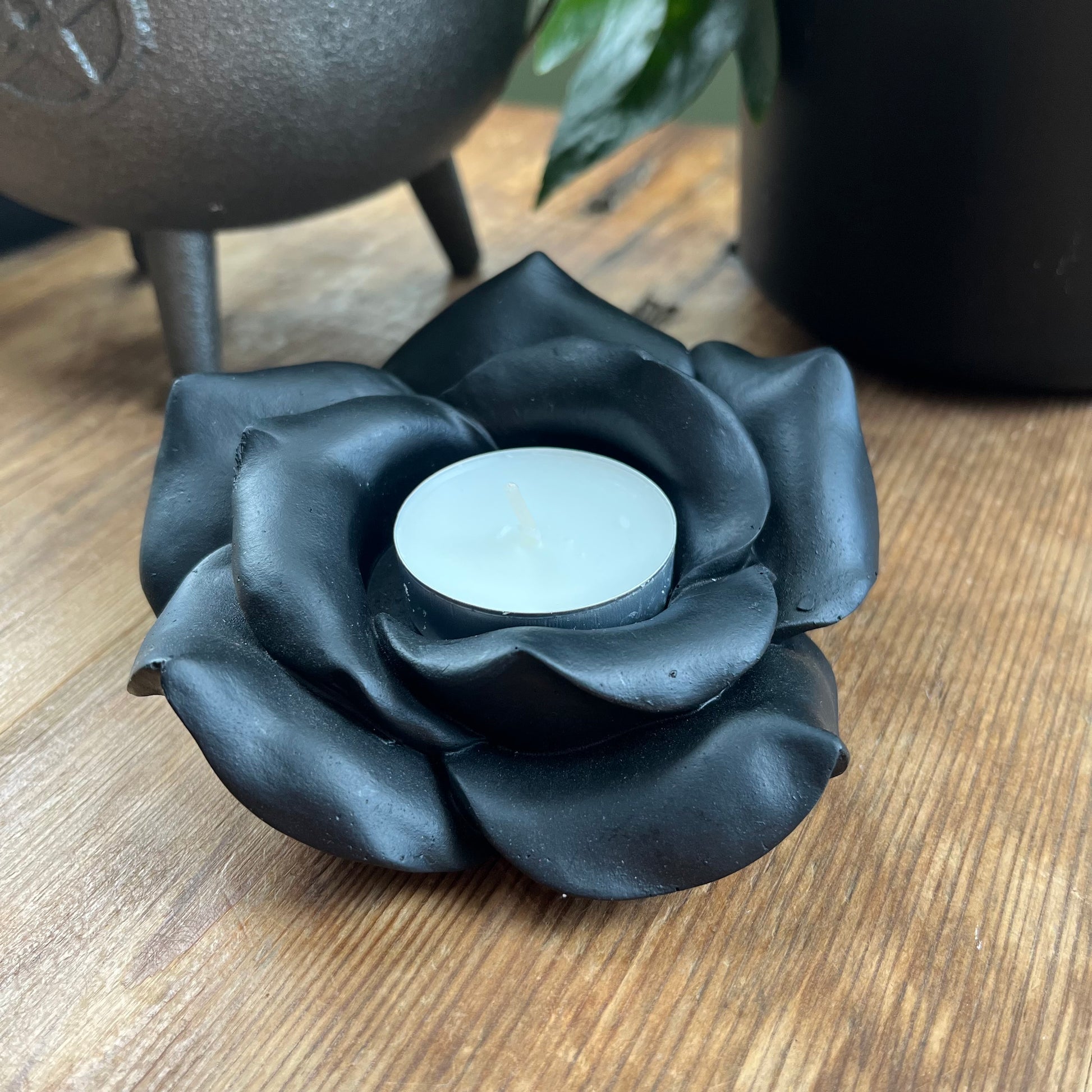 Black Rose Resin Tealight Candle Holder with a white tealight candle