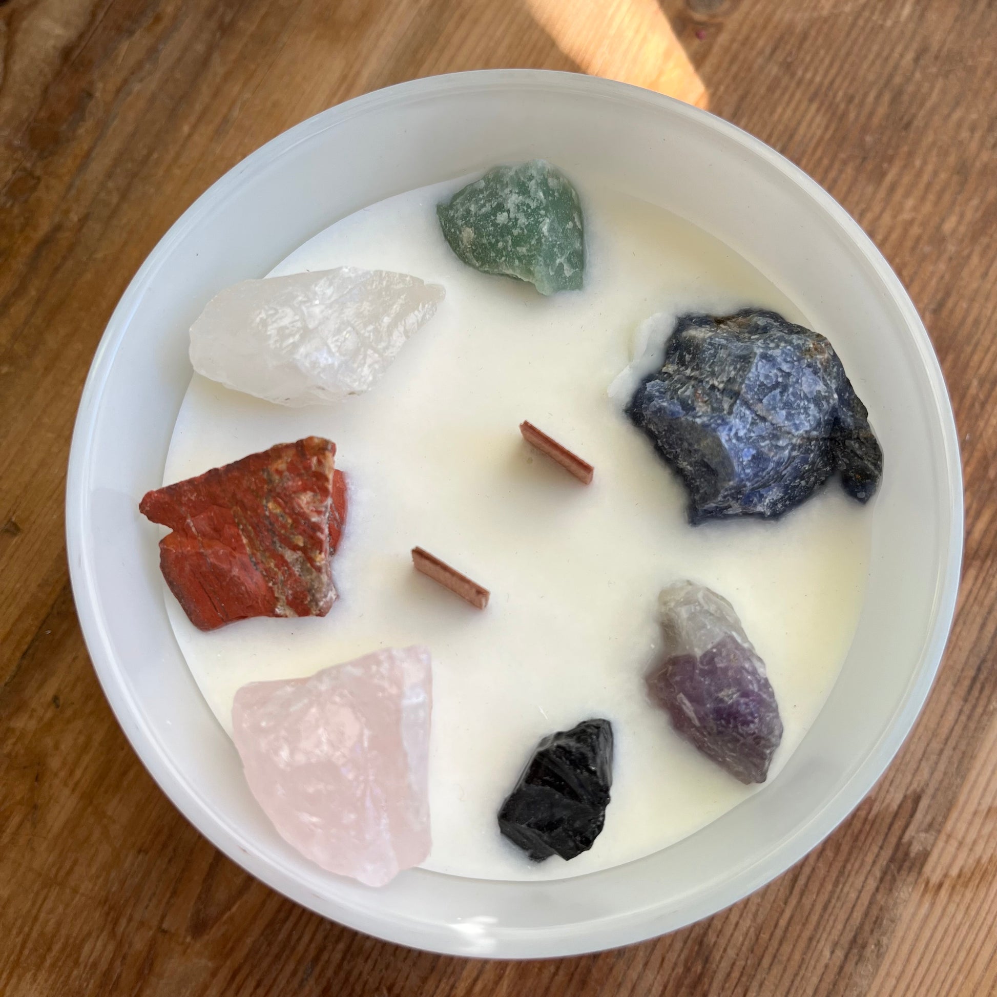 Large white candle with  7 large chunks of raw crystals to align with the 7 chakras 