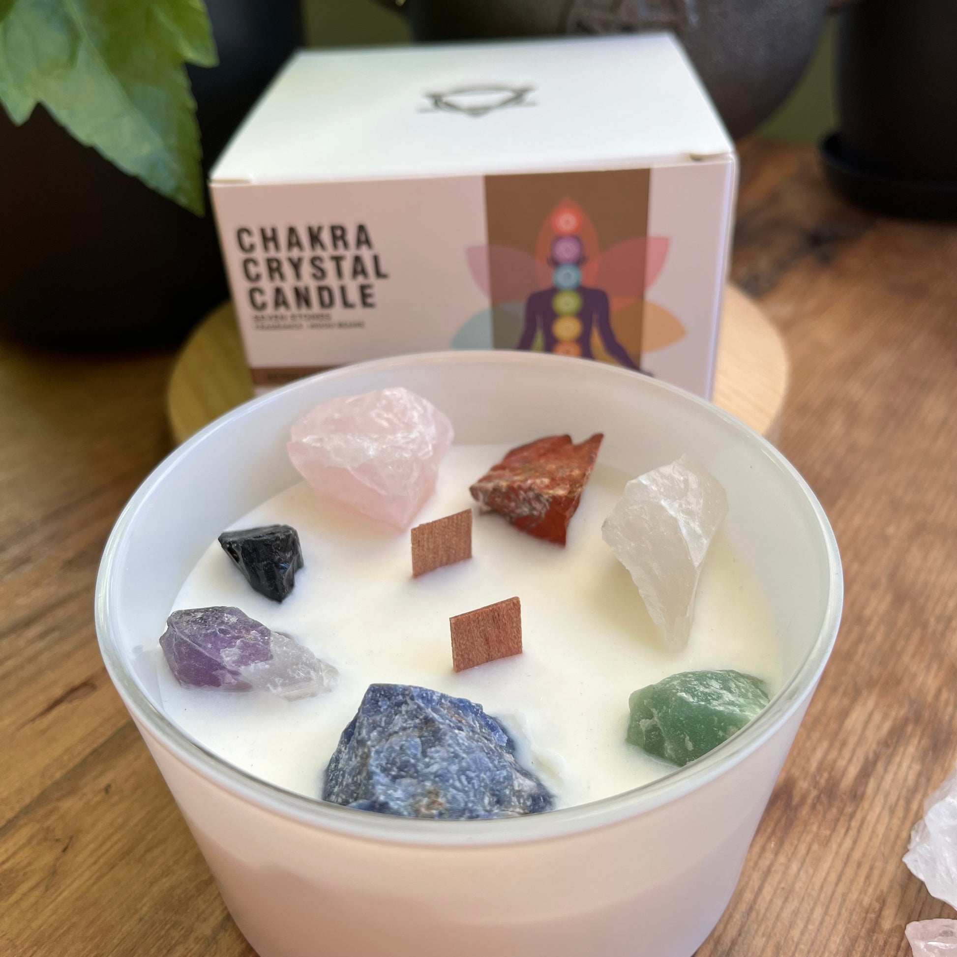 Large white candle with  7 large chunks of raw crystals to align with the 7 chakras 