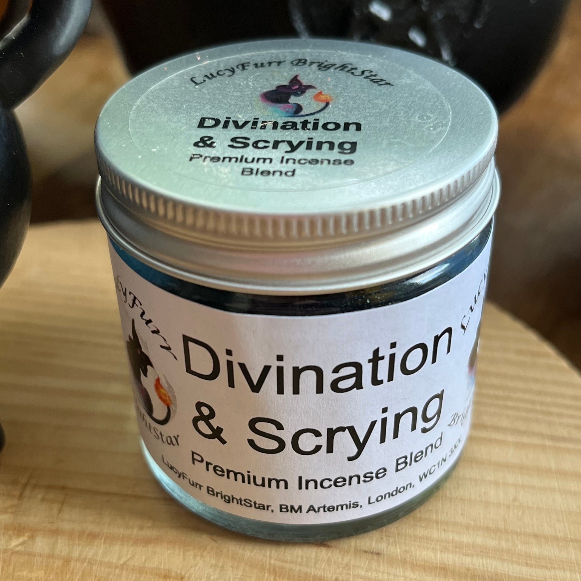 Jar of 'Divination & Scrying' premium incense blend on a wooden surface