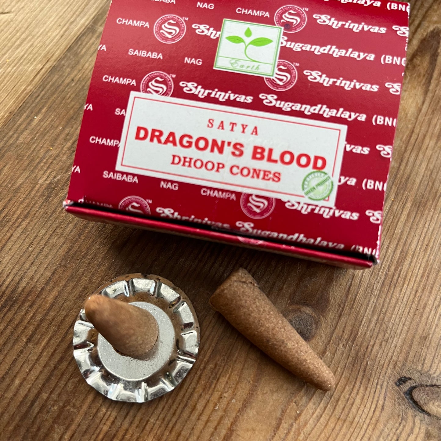 Box of Satya Dragons blood incense cones on wooden surface