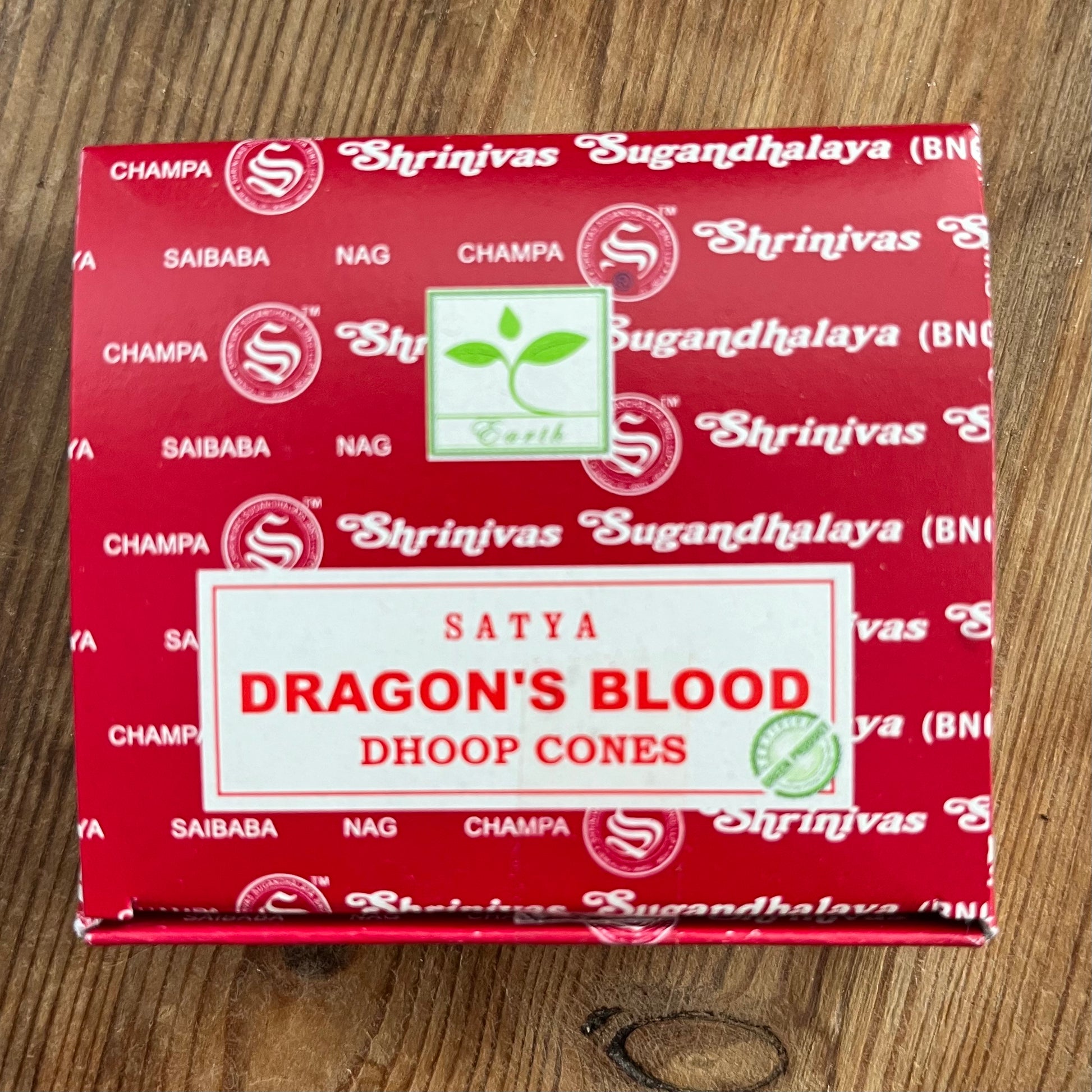 Box of Satya Dragons blood incense cones on wooden surface