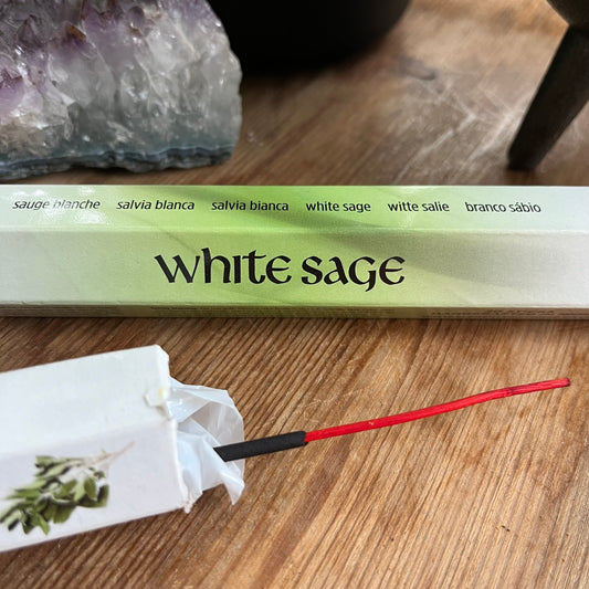 A package of White Sage incense with a green and white label.