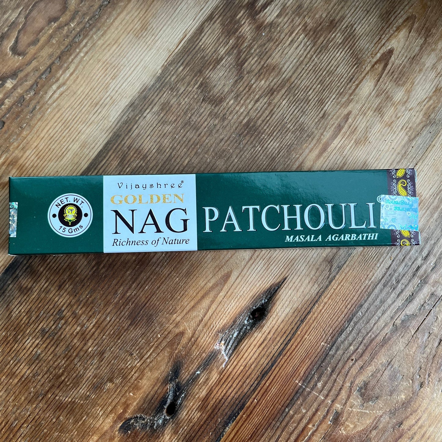 A box of Golden Nag Patchouli incense with a label that includes the product name and the phrase 'Richness of Nature'.