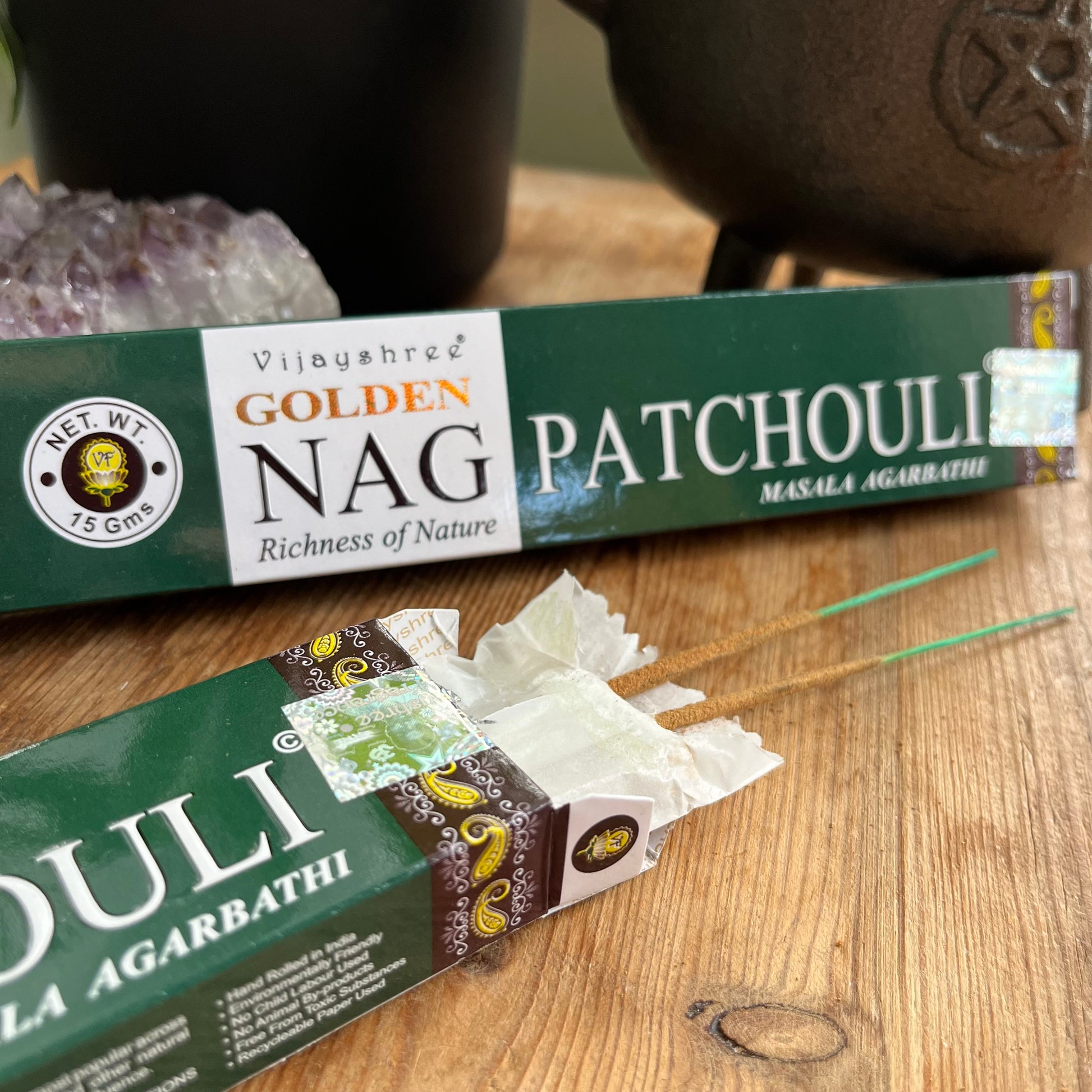 Two boxs of Golden Nag Patchouli incense with a label that includes the product name and the phrase 'Richness of Nature'. One box is open with some incense sticks peeking out 