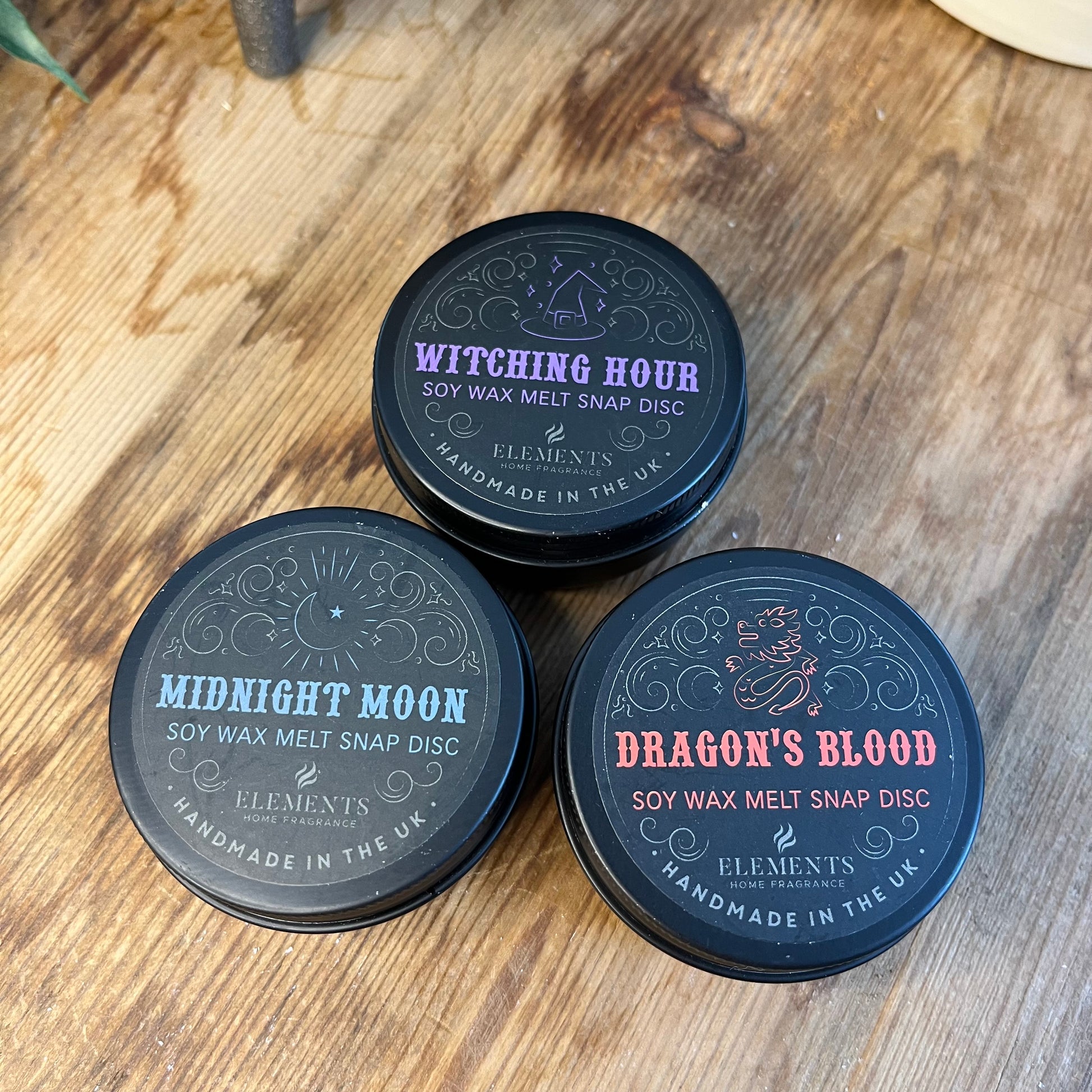 3 soy wax snap disc tins of different scents 1 Dragons Blood 1 Witching hour 1 Midnight Moon 