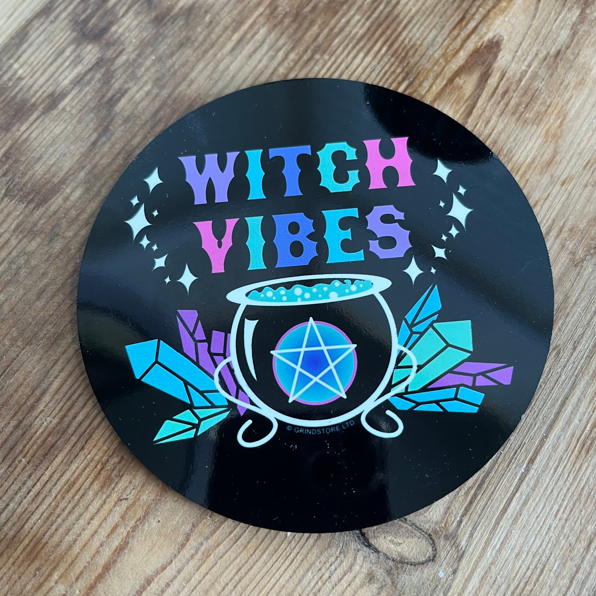 Black Coaster with the words 'witch vibes' in colourful lettering 