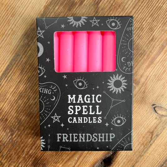 Black Box containing 12 pink spell candles box reads magic spell candles for friendship 