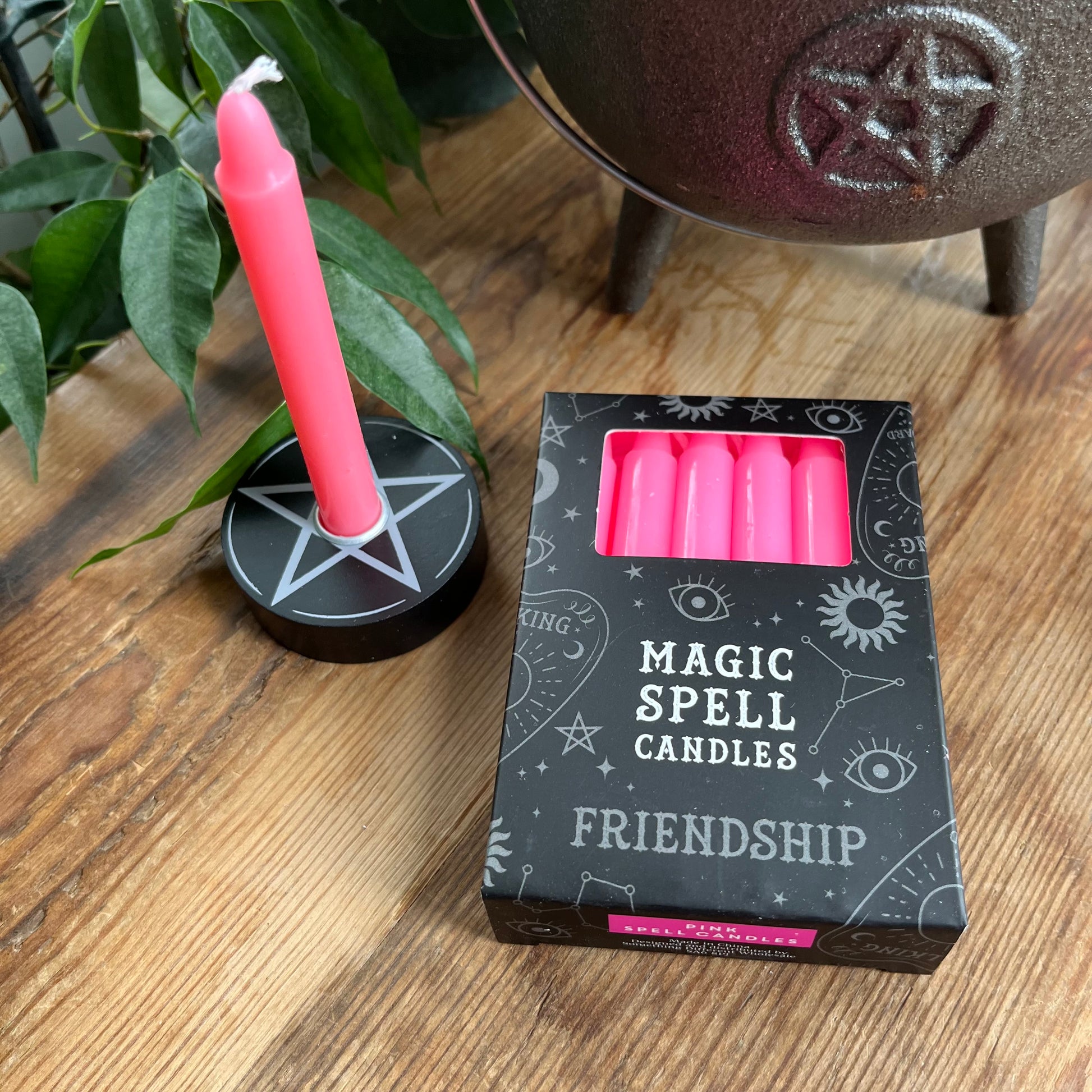 Black Box containing 12 pink spell candles box reads magic spell candles for friendship 