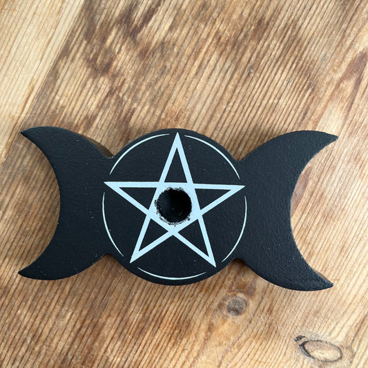 Black wooden spell candle holder in the shape of a triple moon with a Pentagram in white on its surface 