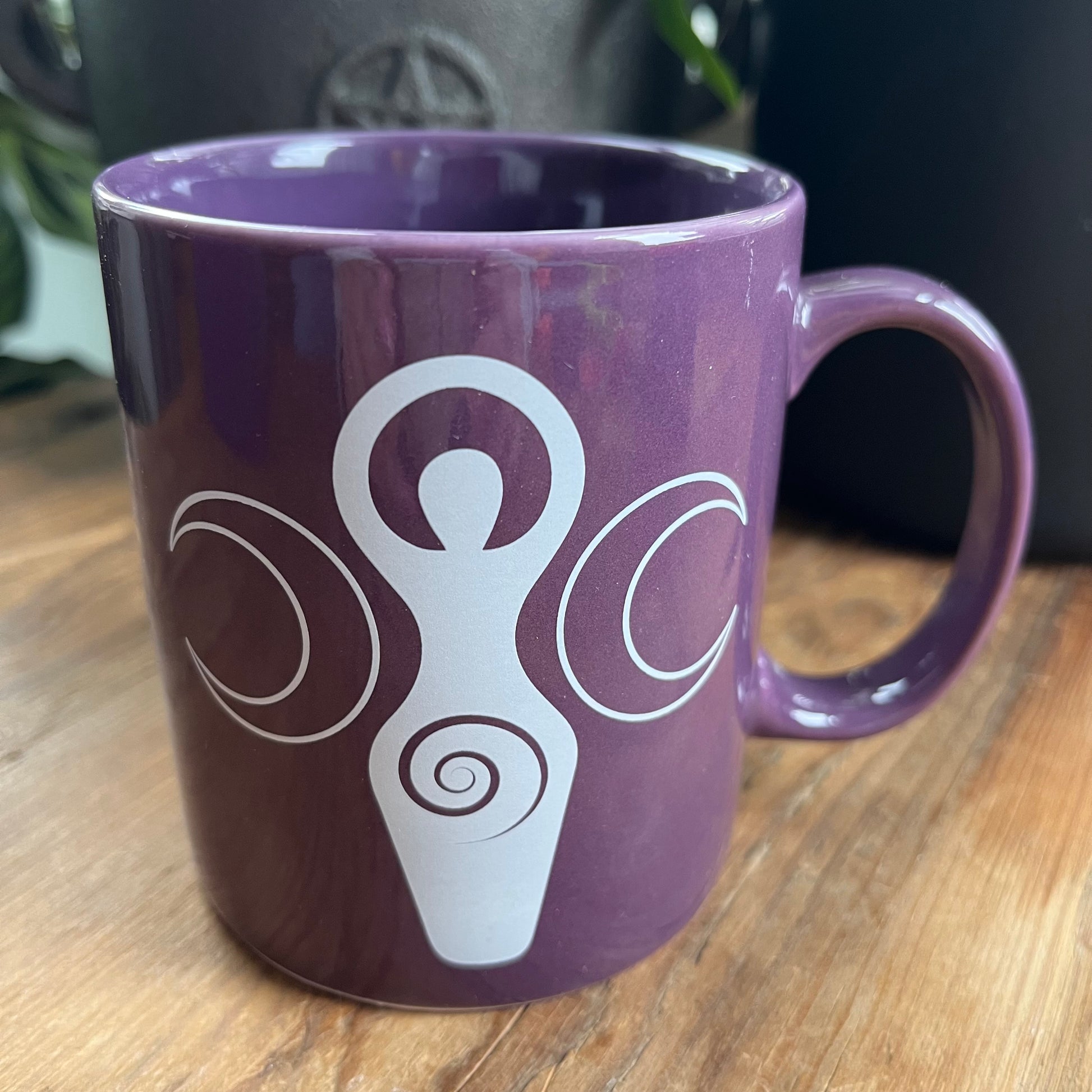 Purple bone china mug featuring a triple moon goddess on both sides