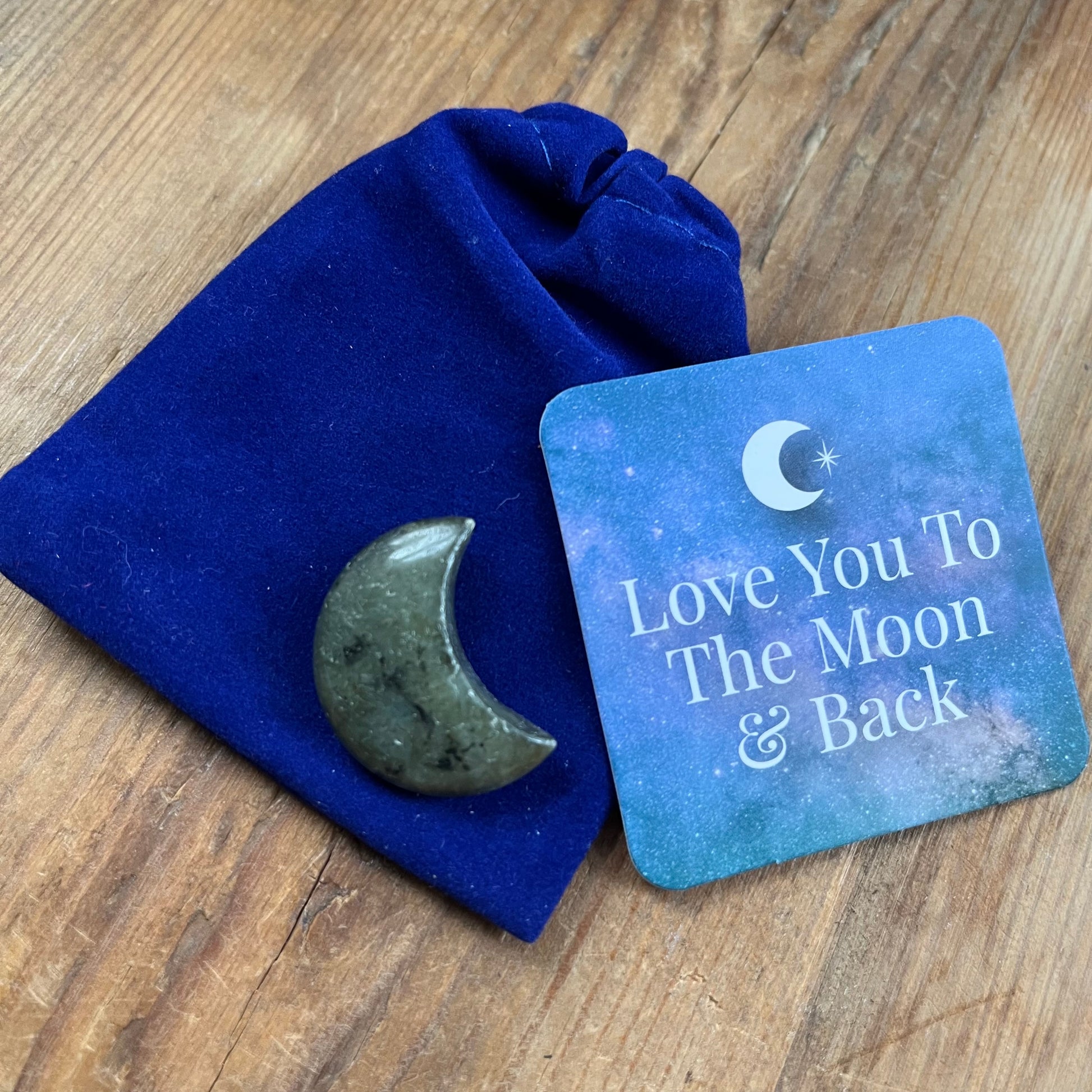 Blue velvet pouch, Labradorite crescent shaped moon and a blue sentiment card with an image f a white crescent moon and the words 'Love you to the moon and back"