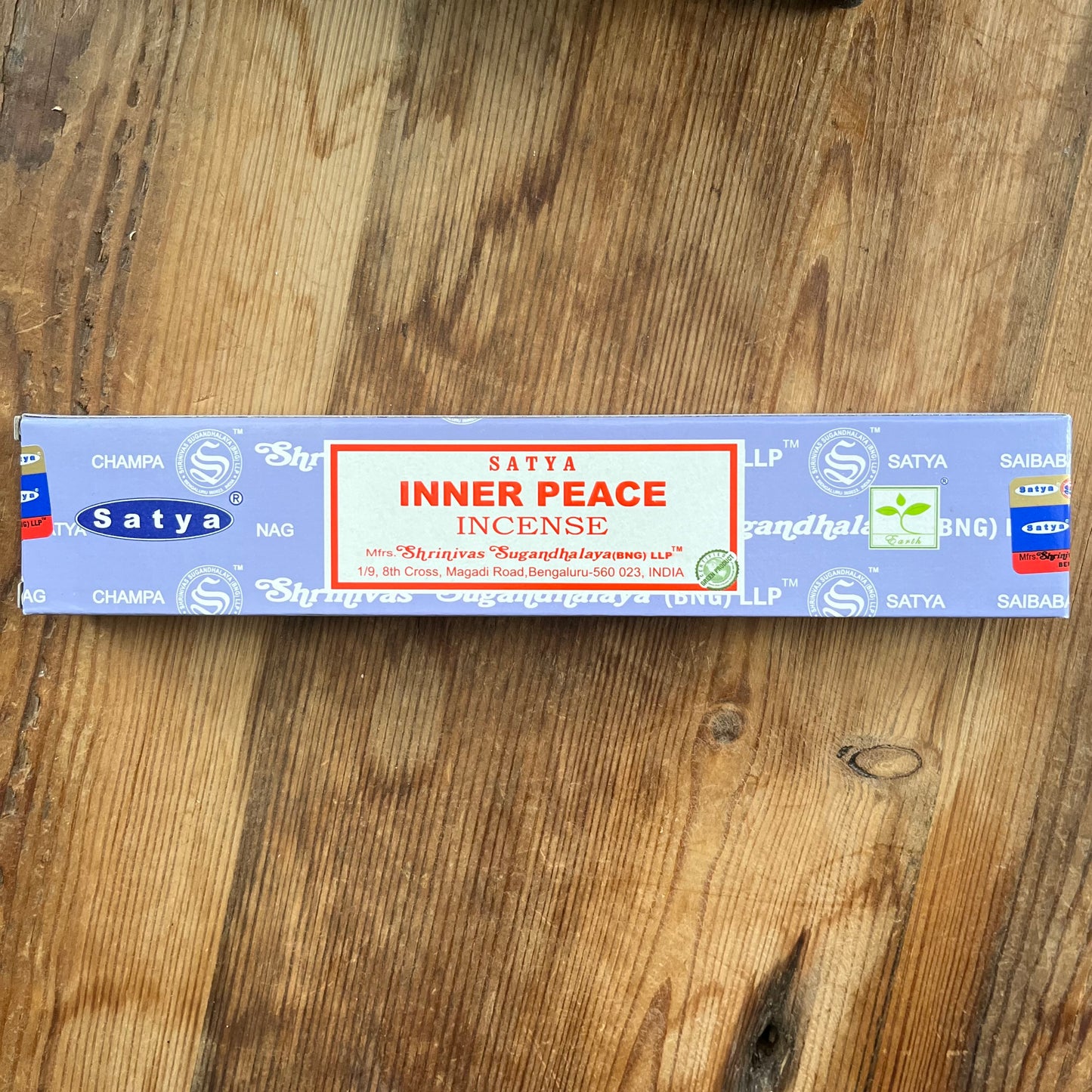 Box of Satya Inner Peace Incense on wooden background 