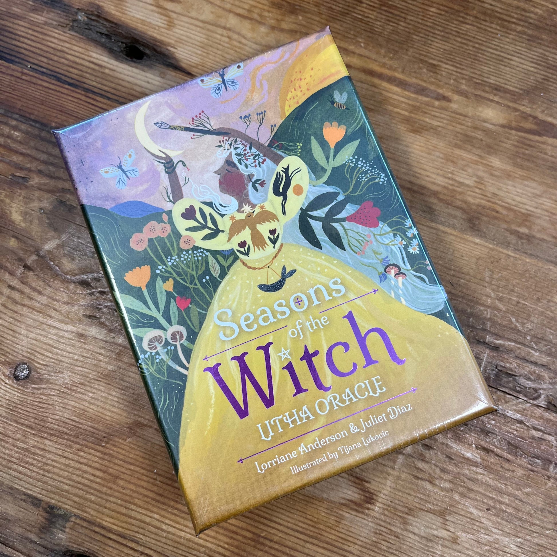 Oracle Card box titled 'Seasons of the Witch' on a wooden surface