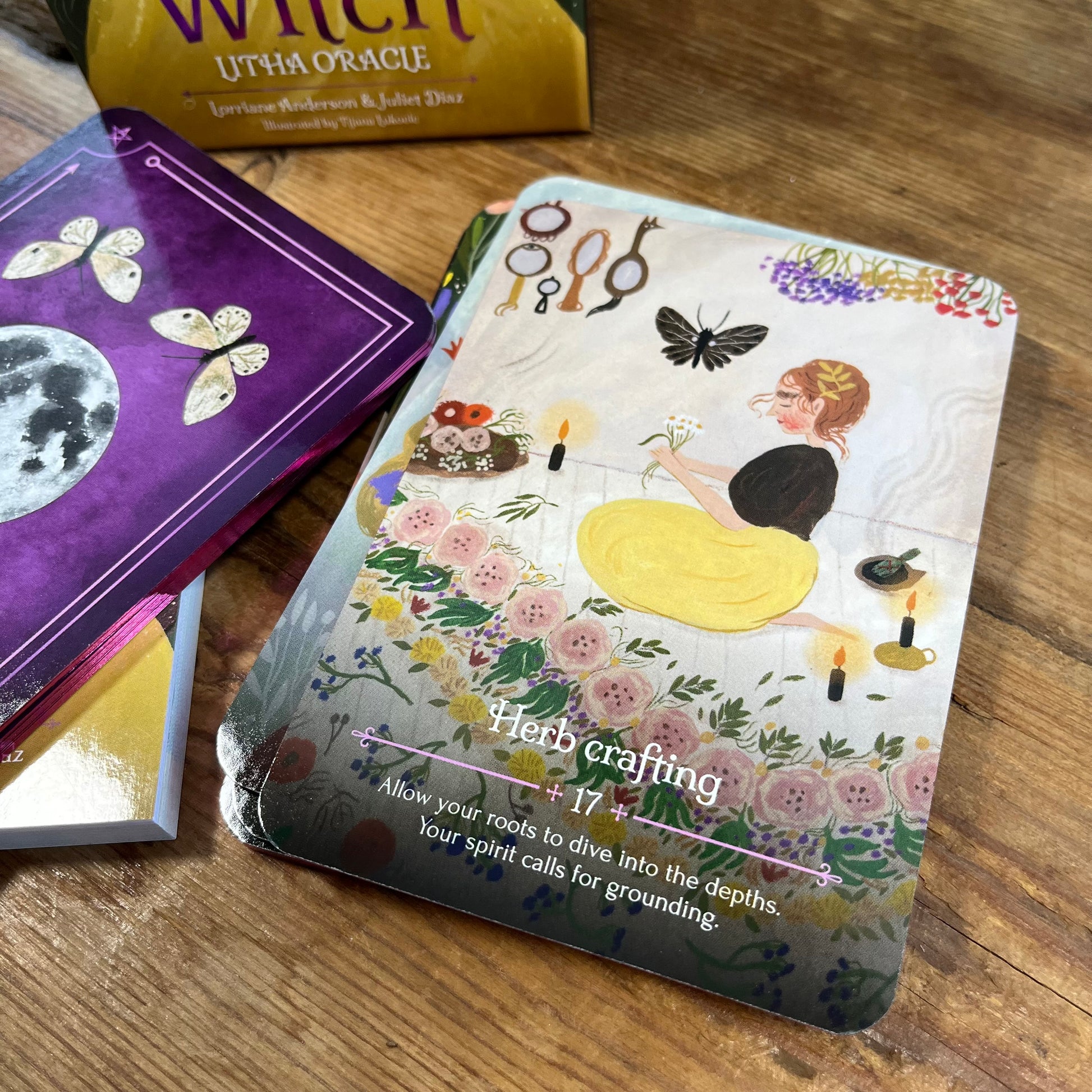 Card with 'Herb crafting' text and illustrations on a wooden surface with other cards in the background.